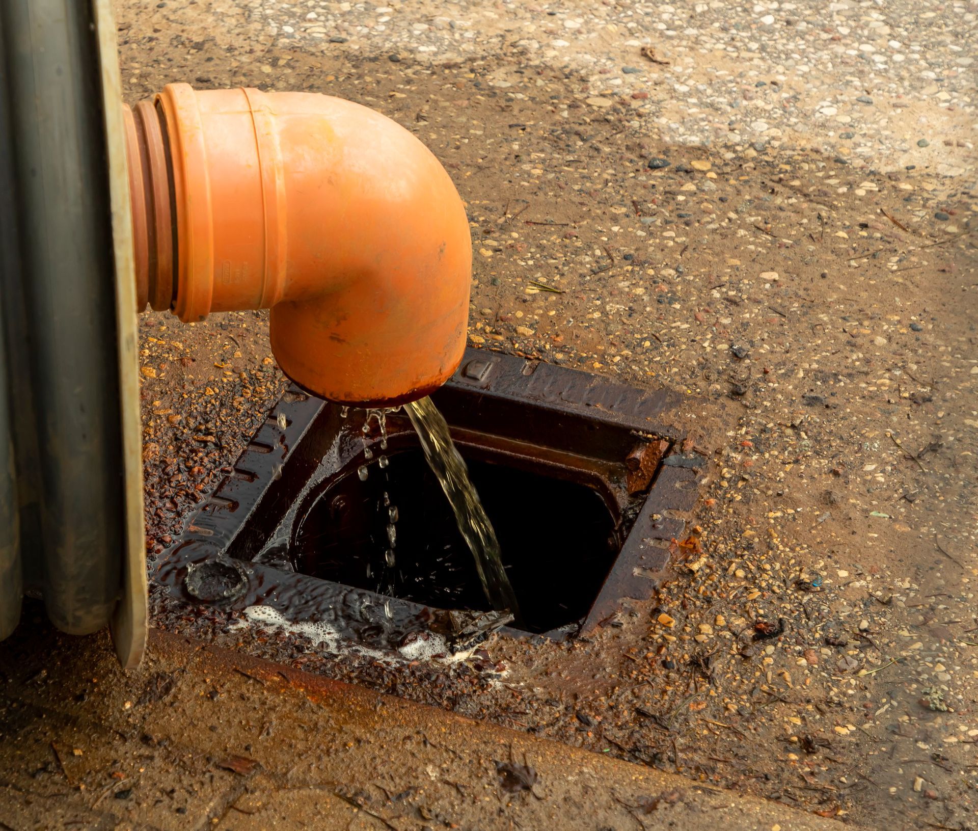 A pipe is coming out of a hole in the ground