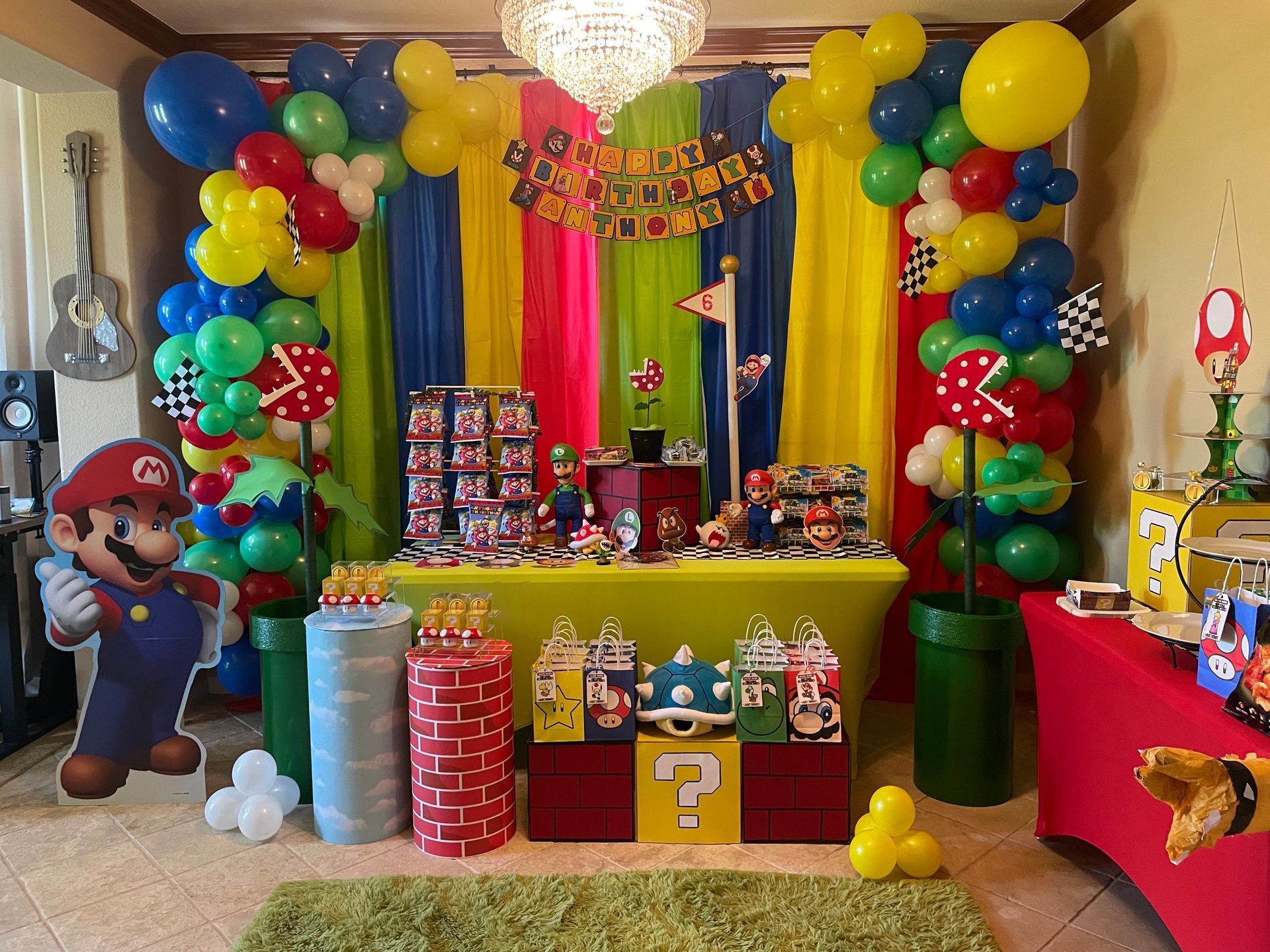 A room decorated for a mario themed birthday party.