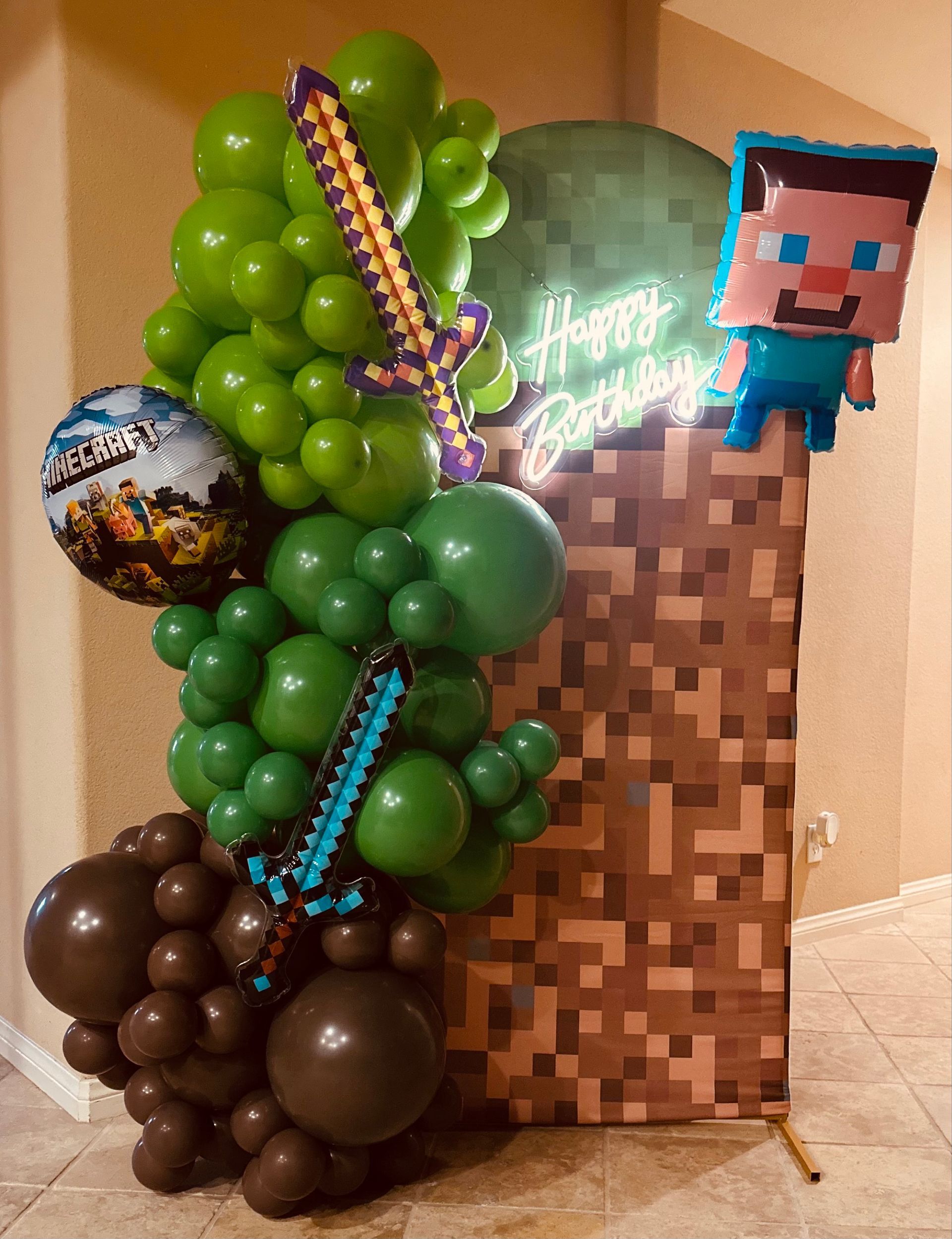A bunch of balloons are sitting on top of a wooden wall.
