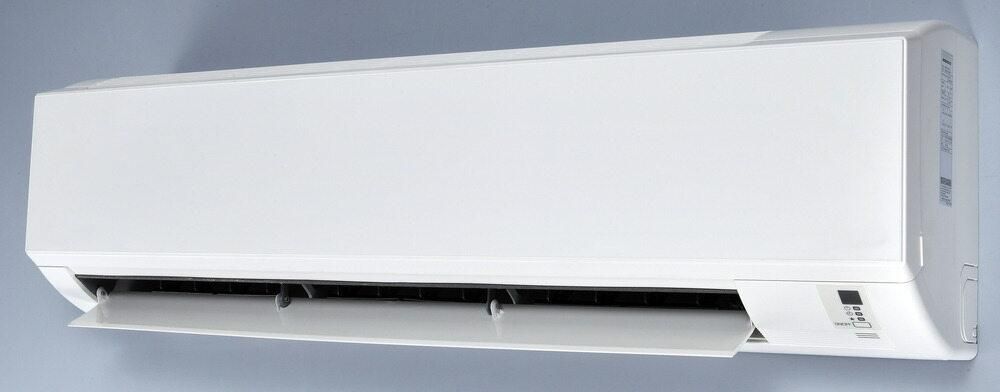 A White Air Conditioner is Hanging on a Wall — AJM's Air Conditioning Centre in Lismore, NSW