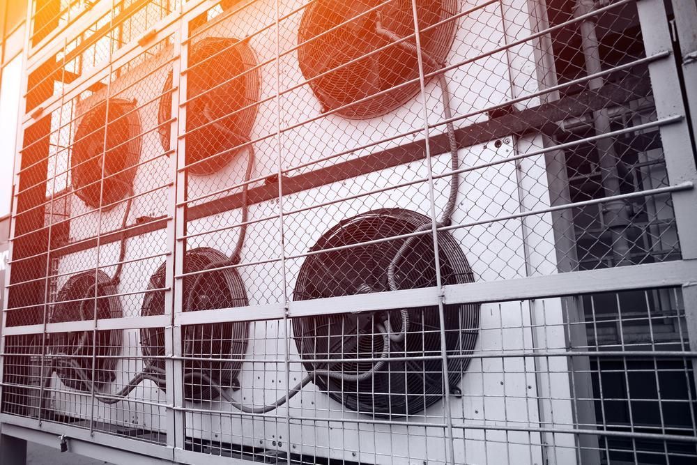 A Bunch of Fans Are Hanging From the Side of a Building— AJM's Air Conditioning Centre in Lismore, NSW