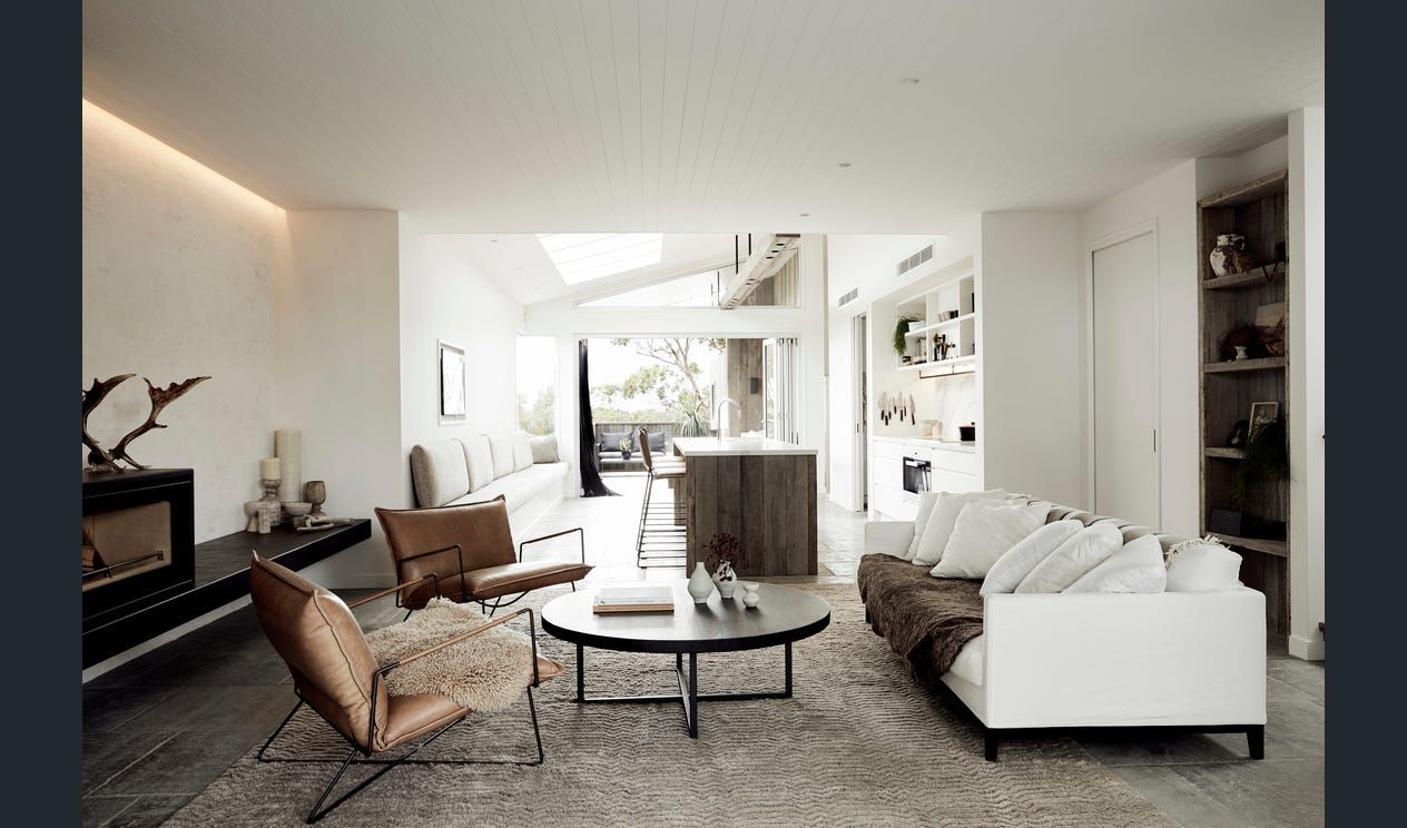 A Living Room With a White Couch and A black coffee table — AJM's Air Conditioning Centre in Lismore, NSW