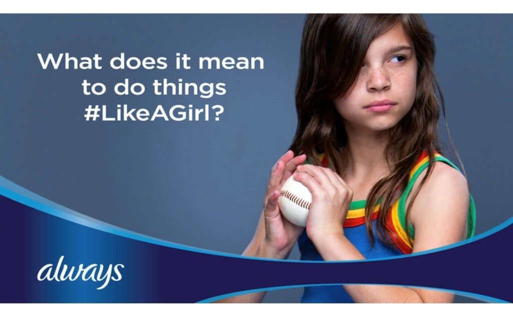 Young softball player holding a ball, with text: “What does it mean to do things #LikeAGirl?”