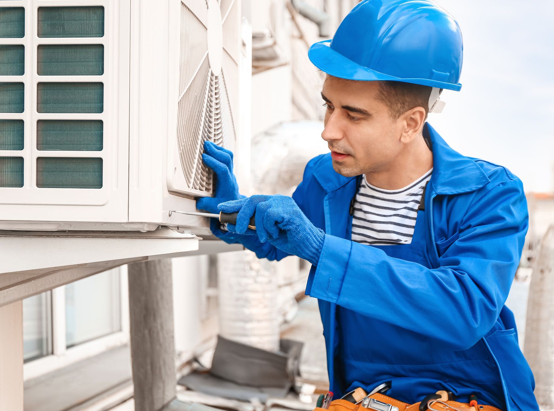 HVAC connected to hoses used for measuring refrigerant pressure during air conditioning maintenance. HVAC connected to hoses used for measuring refrigerant pressure during air conditioning maintenance.