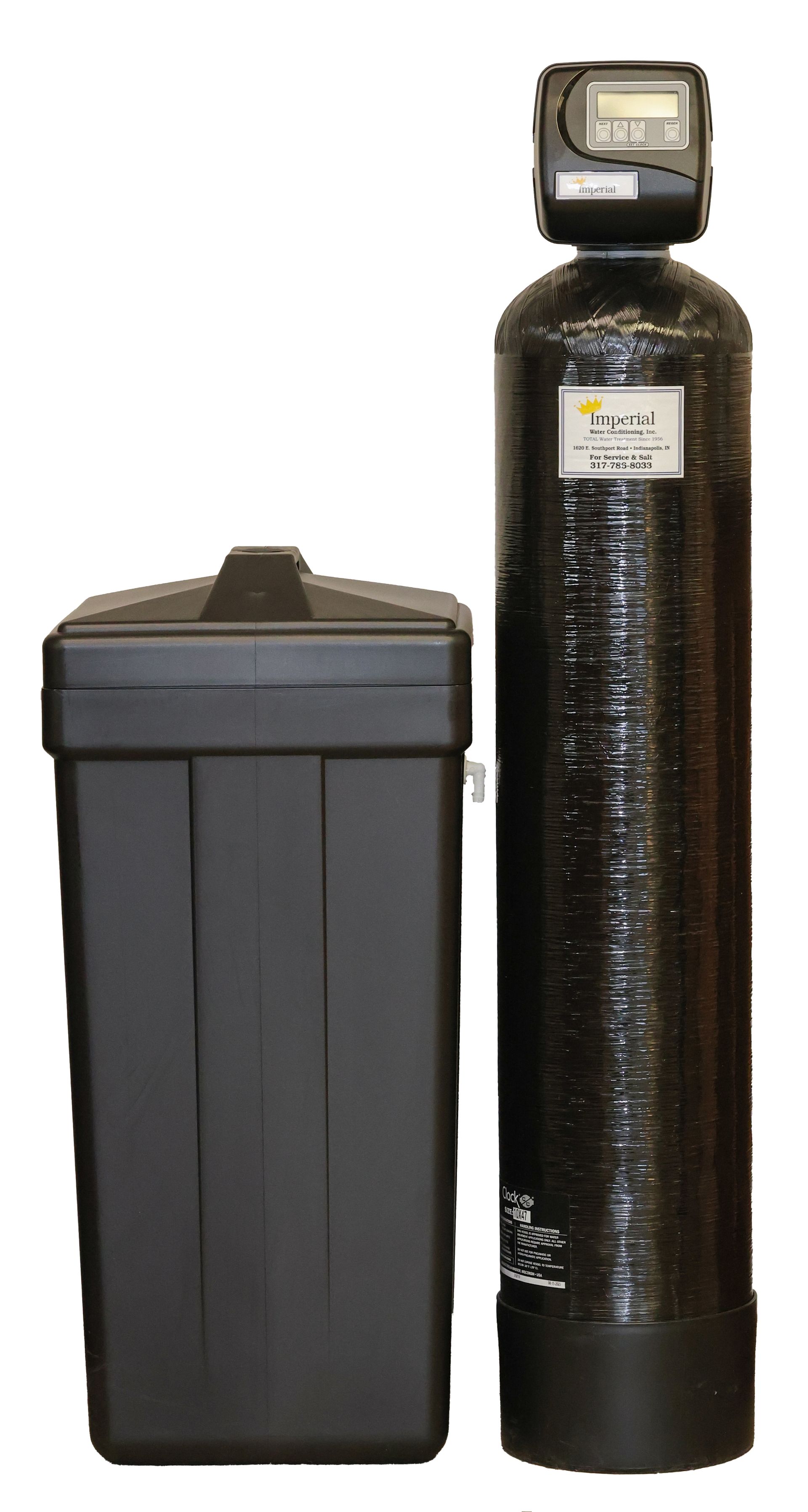 A black water softener is sitting next to a black container.
