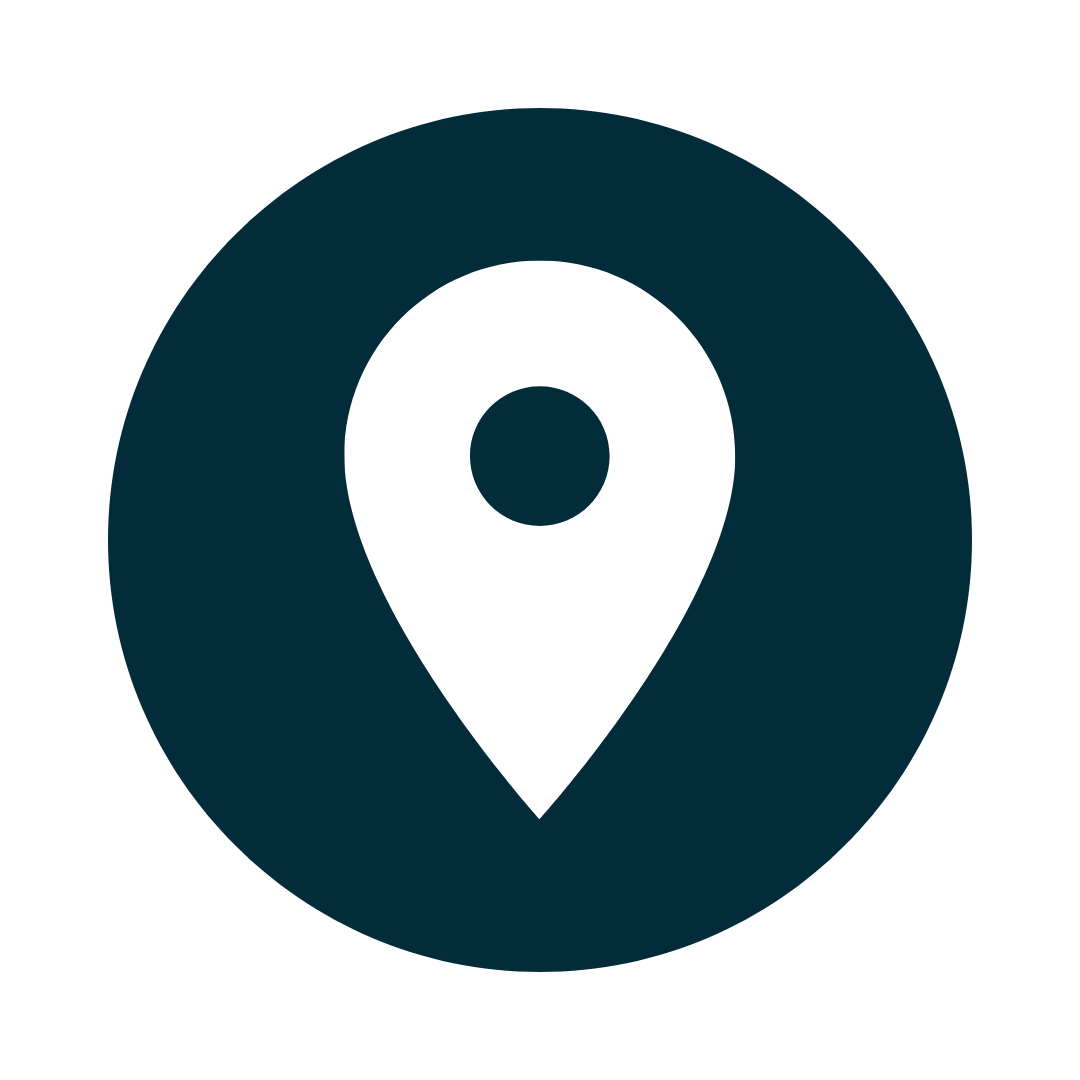 White location pin icon in a dark blue circle.