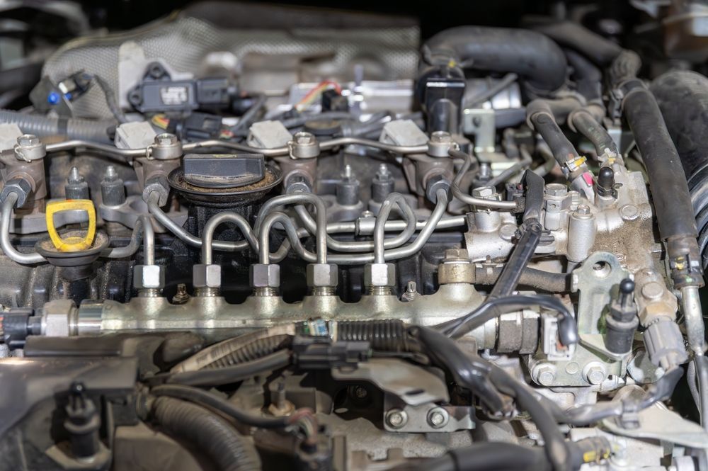 Close-up of a car engine with a yellow-highlighted component on the left side. — Bundaberg Field Service in Gin Gin, QLD
