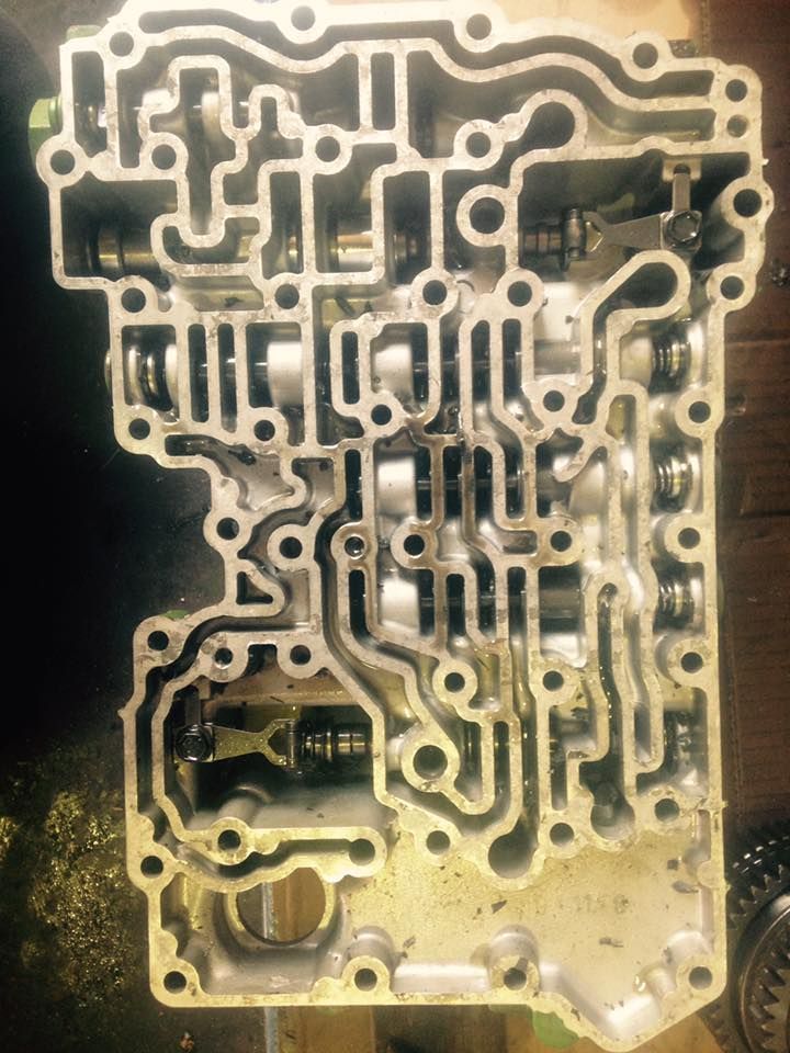Close-up of a metallic circuit board with intricate gold traces and components on a dark background — Bundaberg Field Service in Bundaberg East, QLD