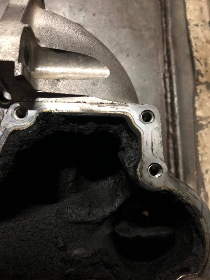 Close Up of A Dirty Engine Intake or Exhaust Port with Heavy Carbon Buildup — Bundaberg Field Service in Bundaberg East, QLD
