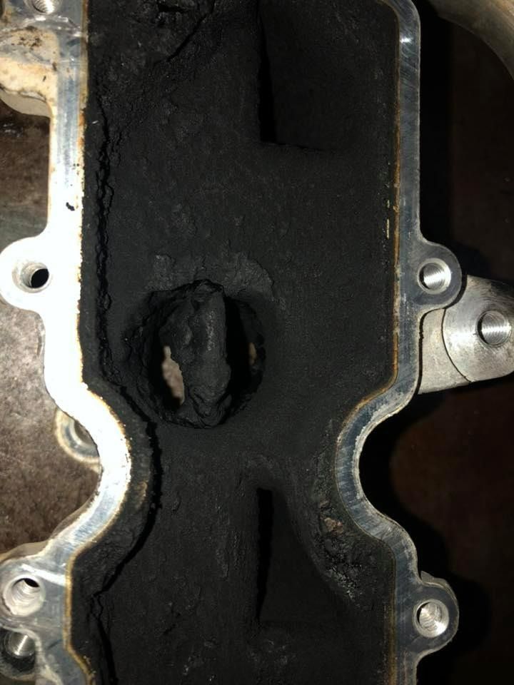 Blackened Engine Intake Manifold Interior with Heavy Carbon Buildup — Bundaberg Field Service in Bundaberg East, QLD