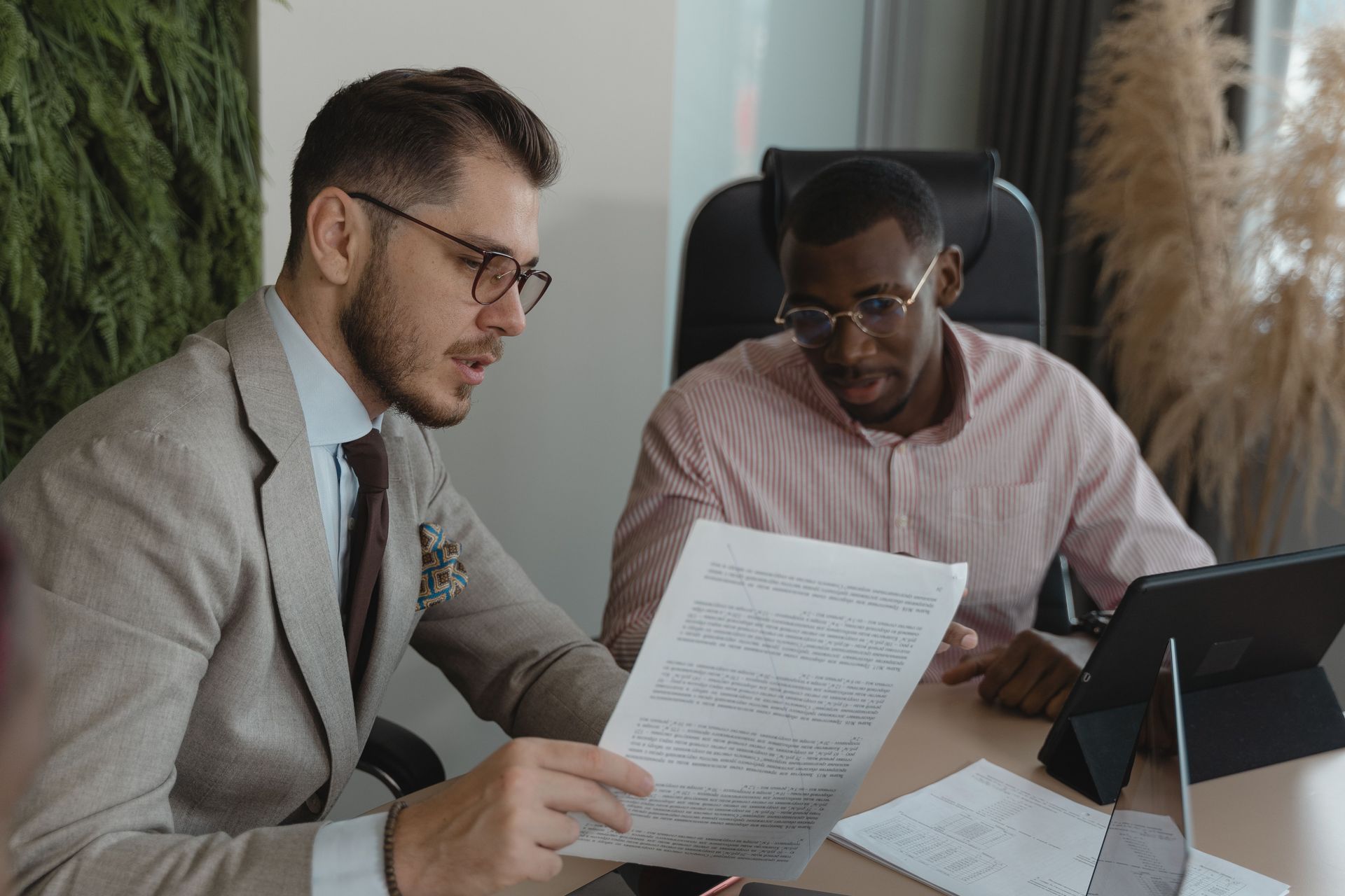 Company director reviewing relevant life insurance options with a financial adviser.