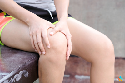 Person holding their knee. 