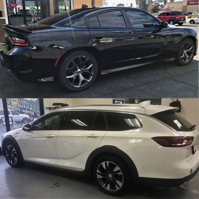 A black car and a white car are side by side