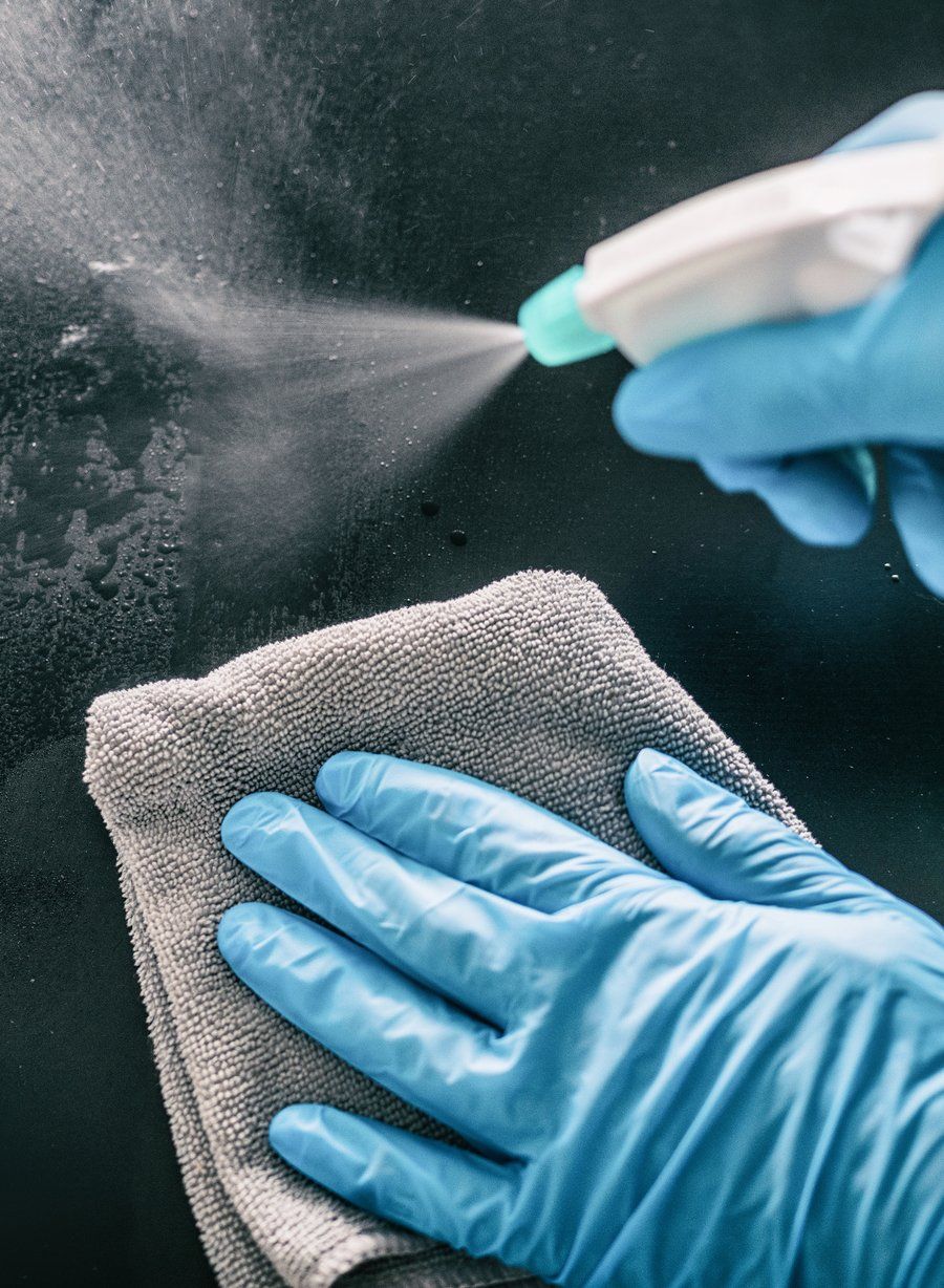 Office cleaning technician cleaning a workspace in Louisville, KY