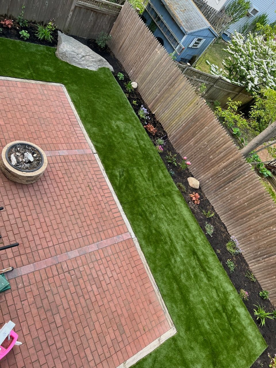 synthetic grass installation in backyard