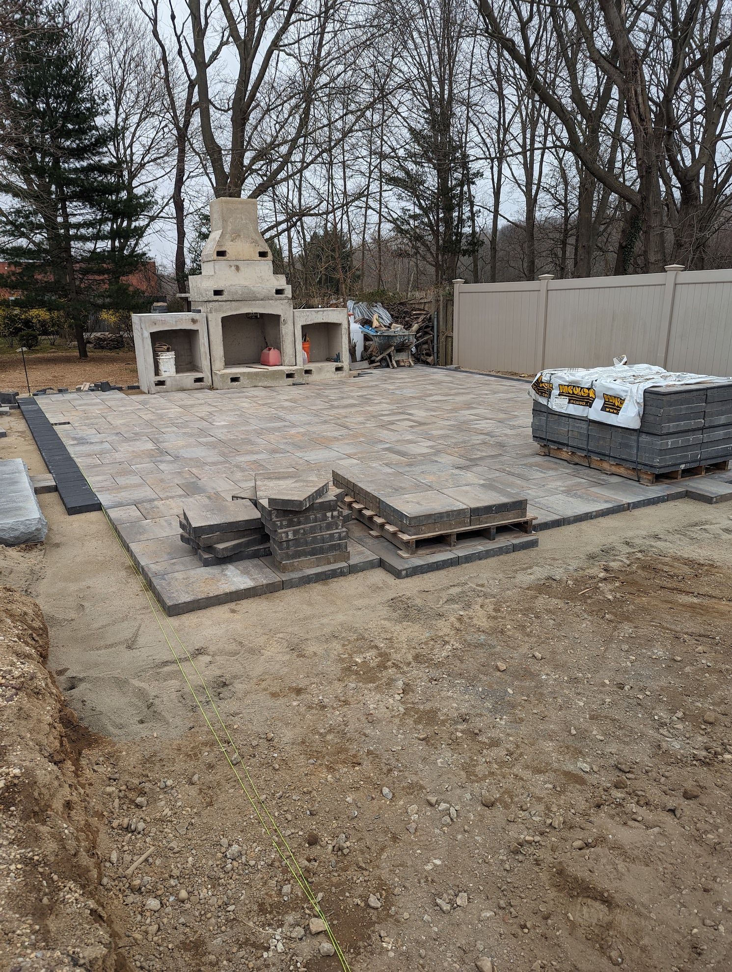 new pavers patio installation and fireplace