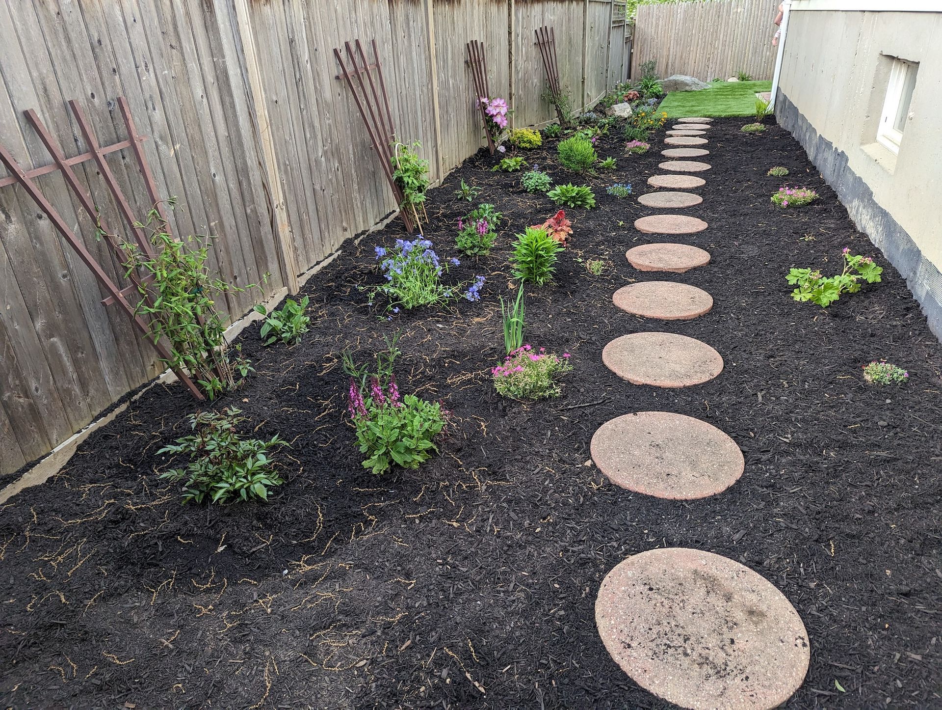 landscaping installed and mulch installation with paver steps down the middle