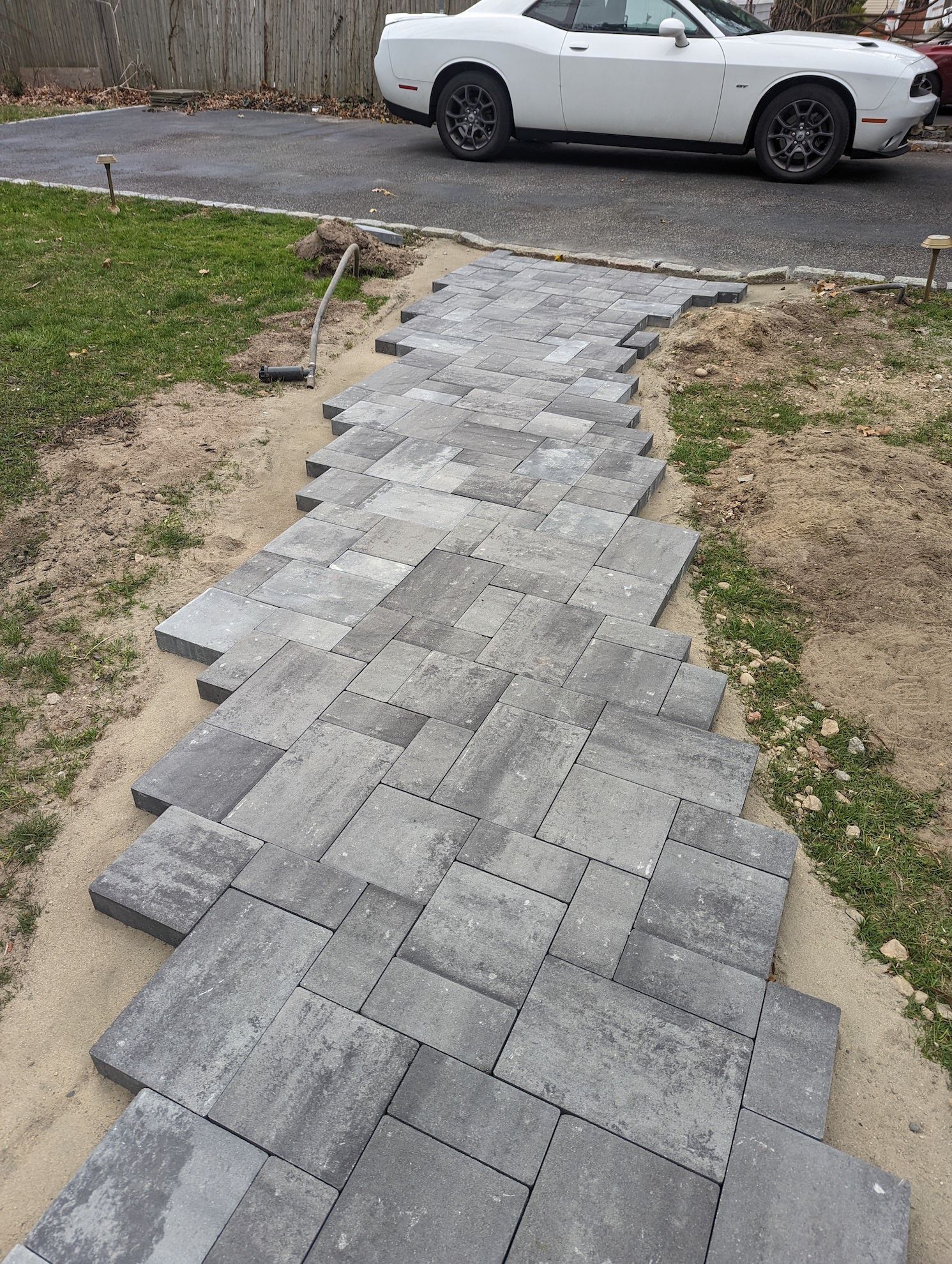new paver walkway to the driveway in progress