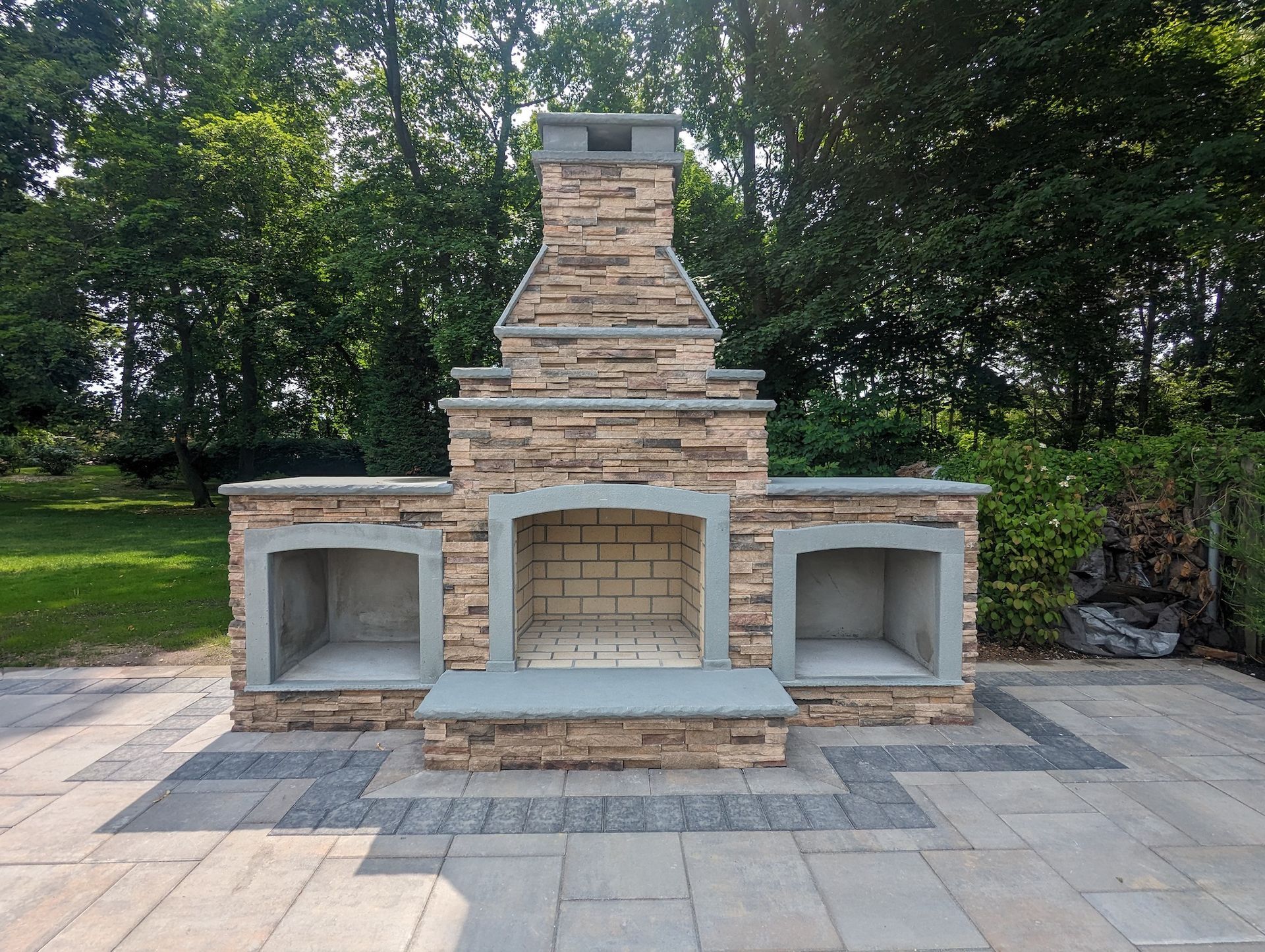 tile patio area with three fireplace area