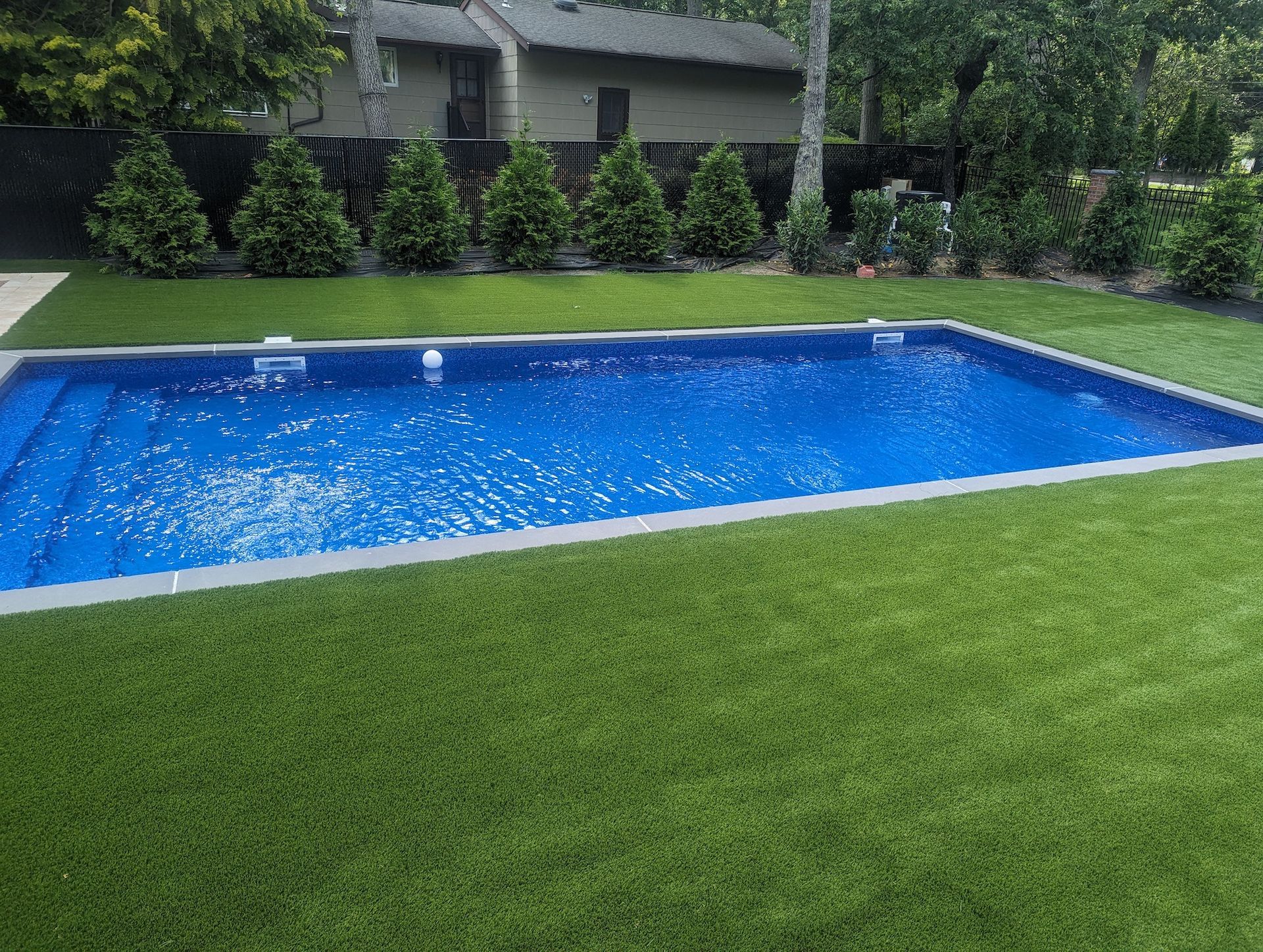 Residential artificial turf install around pool