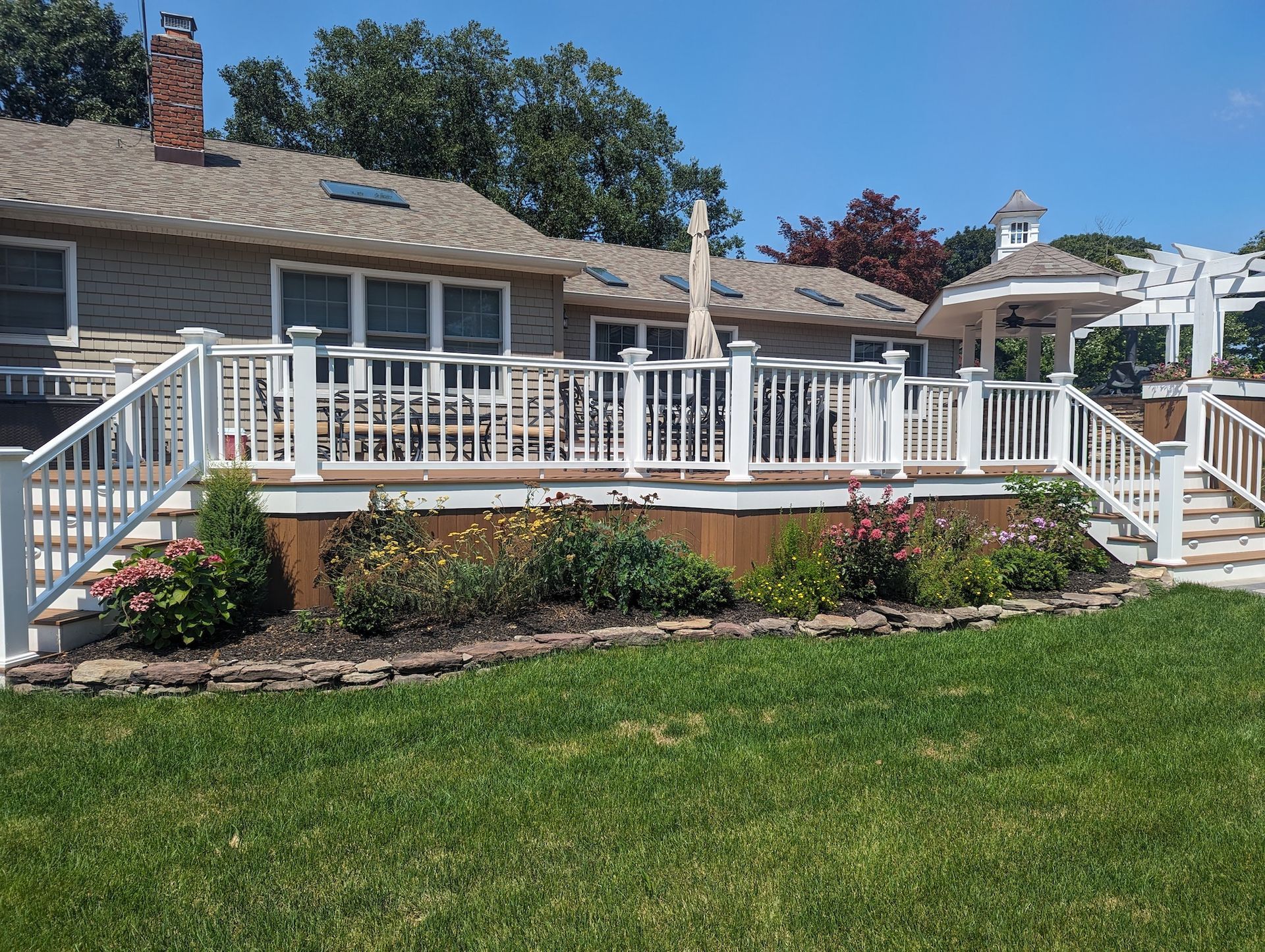 new landscape design & installation around deck area