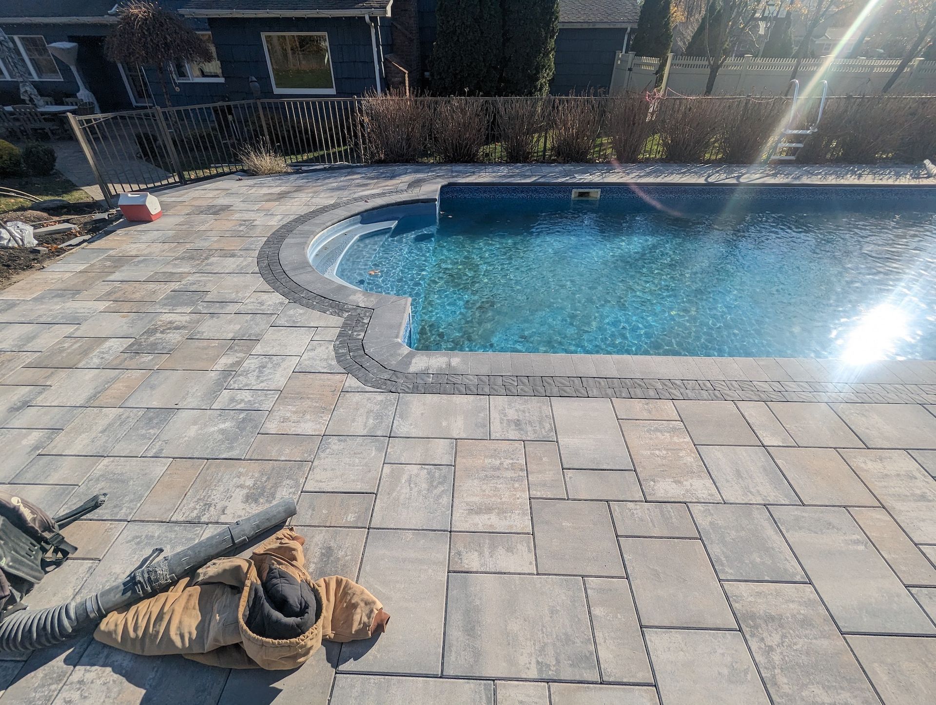 accent tile install around pool