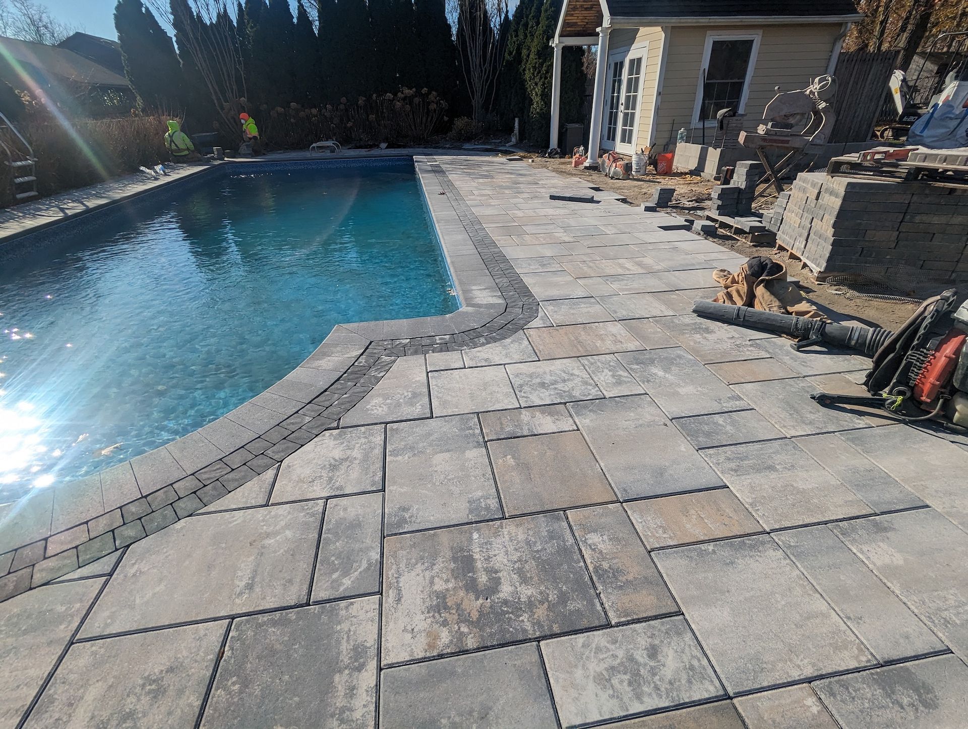 new tile installation around pool