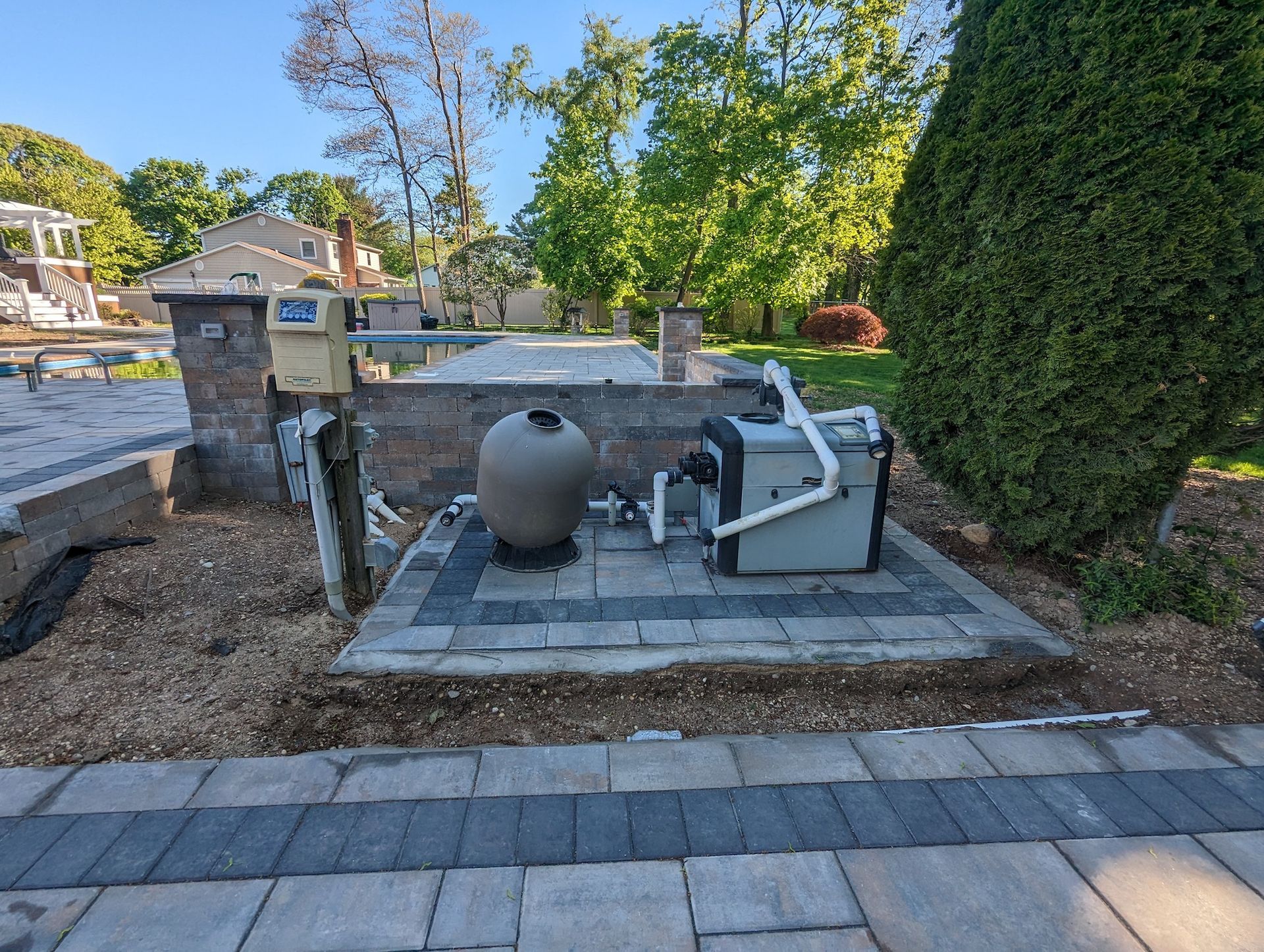 new paver pad installed for pool equipment