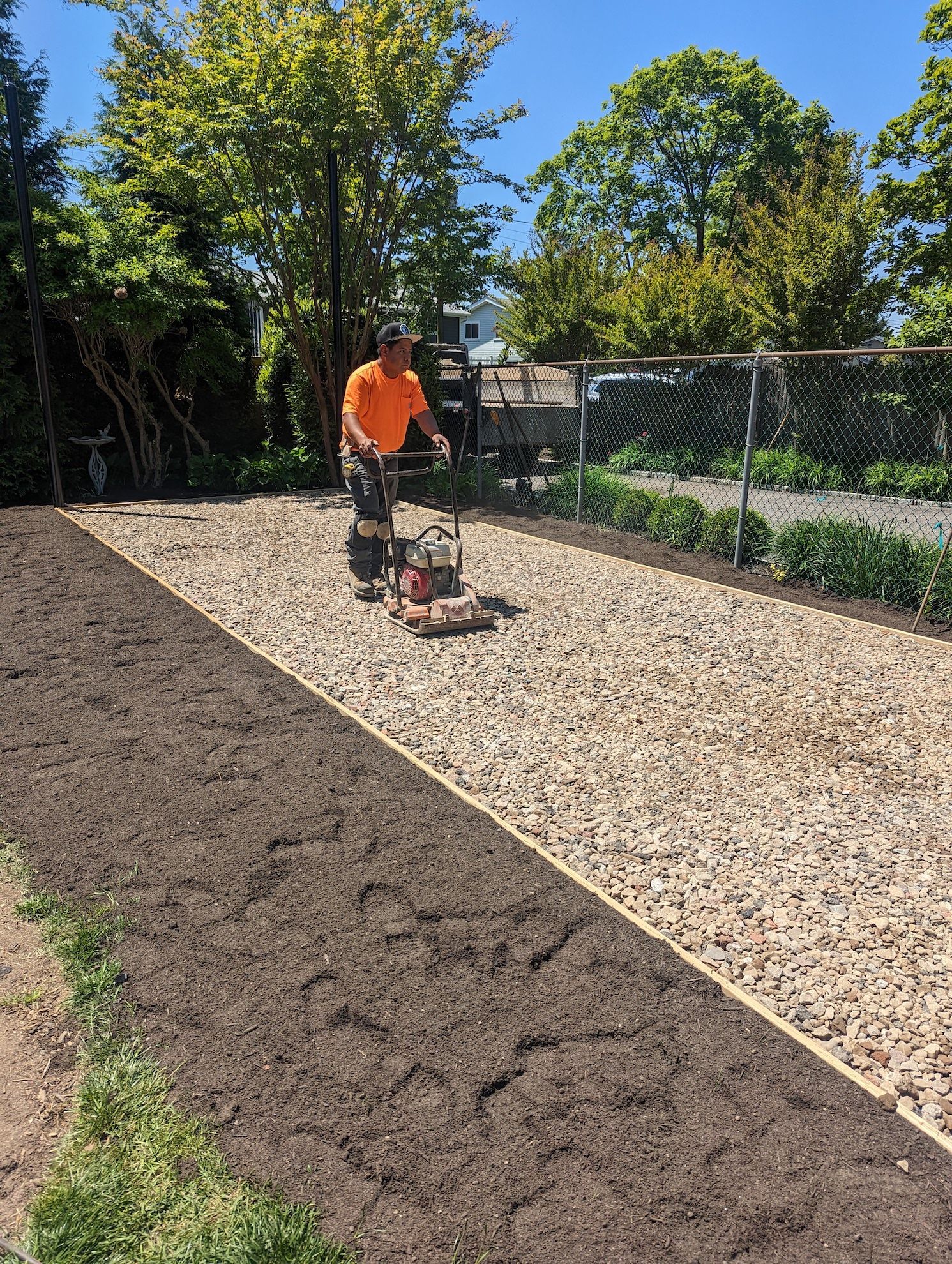 new synthetic turf preparation laying gravel