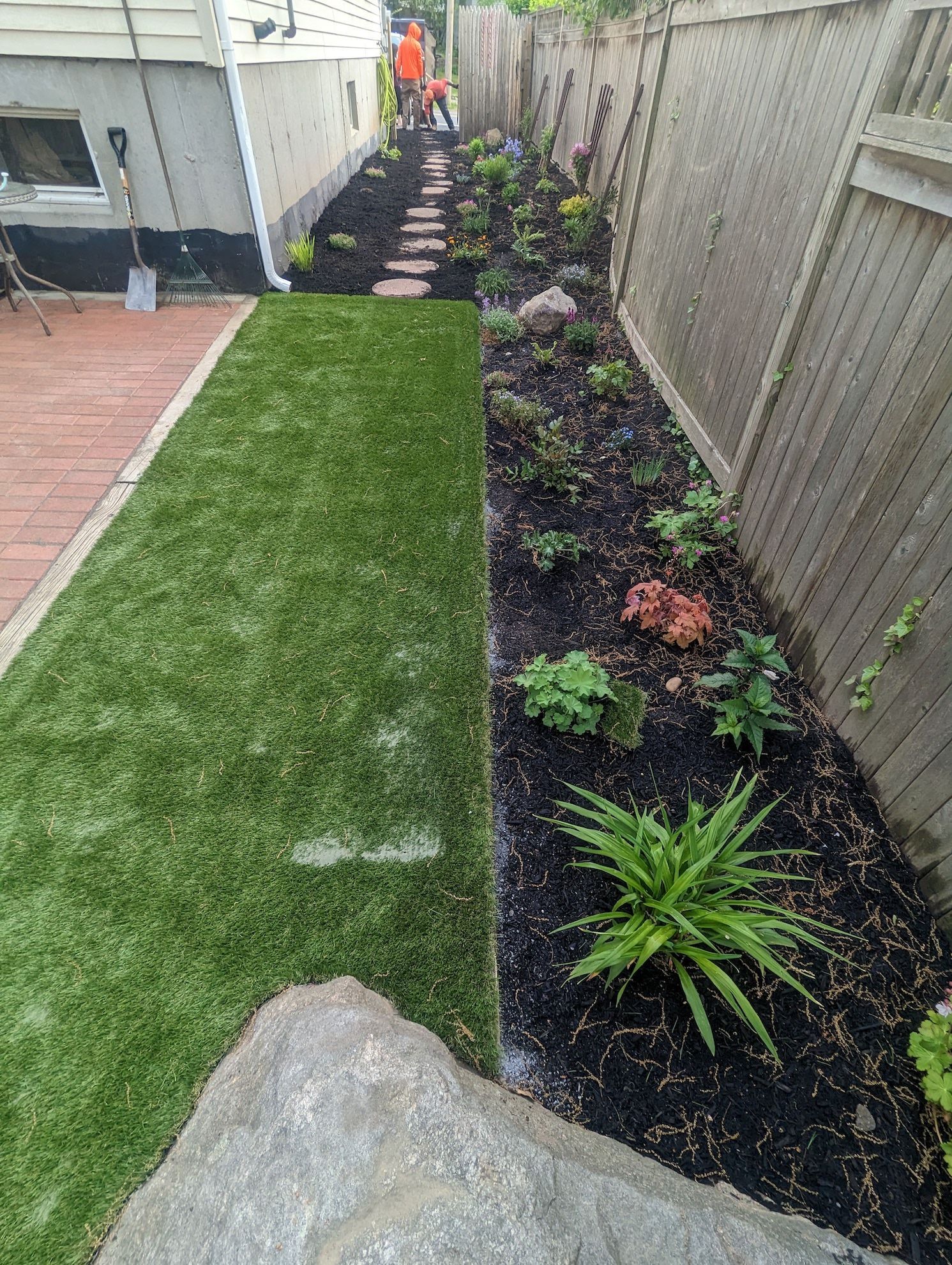 landscaping installed along the side fencing