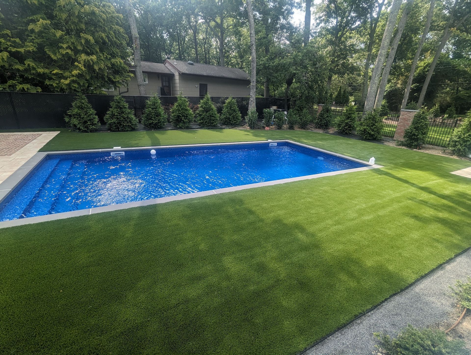new synthetic grass around pool area