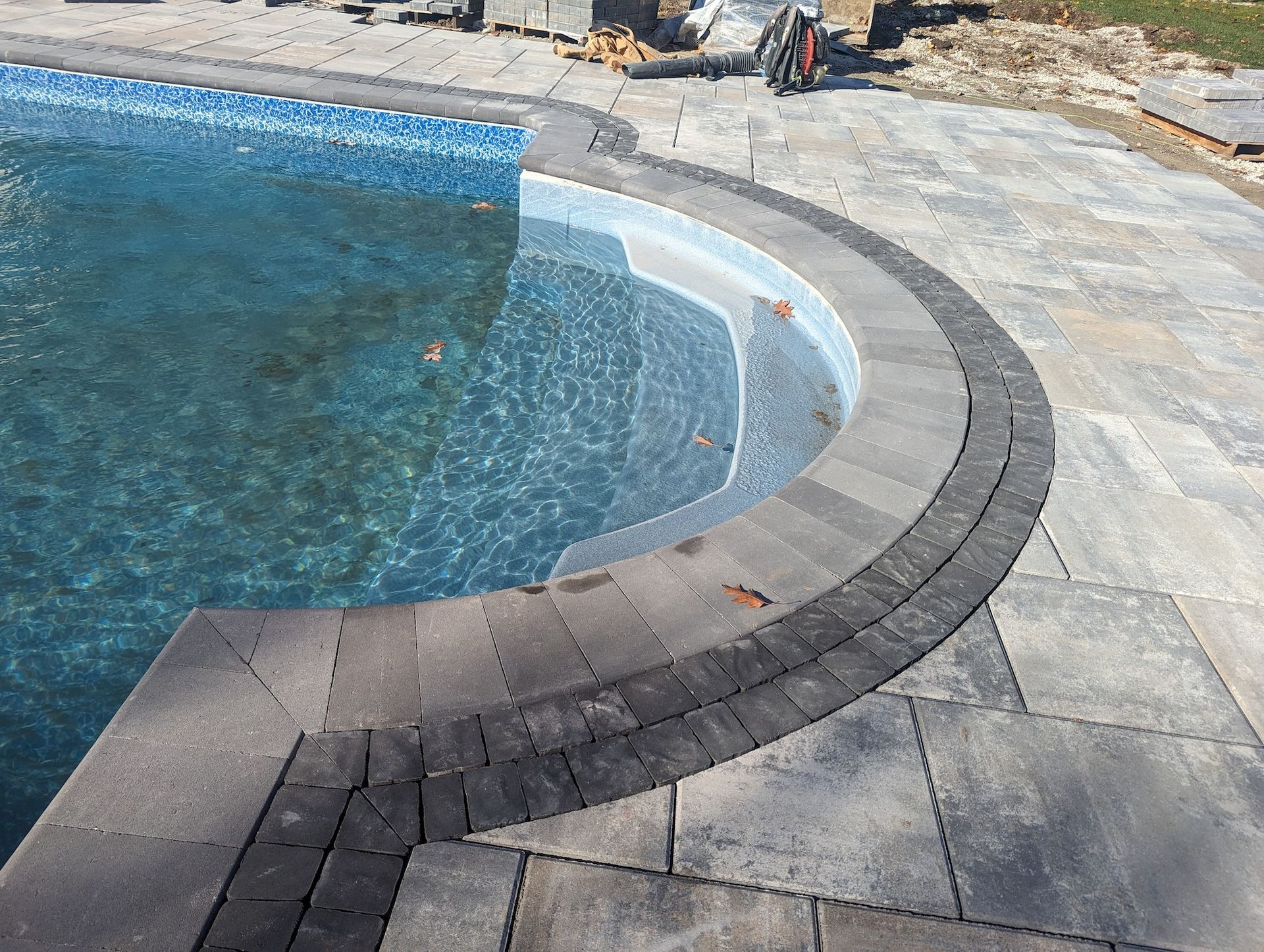 another view of new tile install around pool