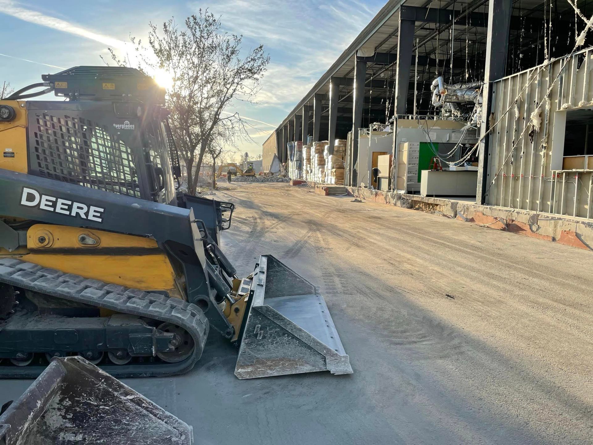 A large excavator is demolishing a house.