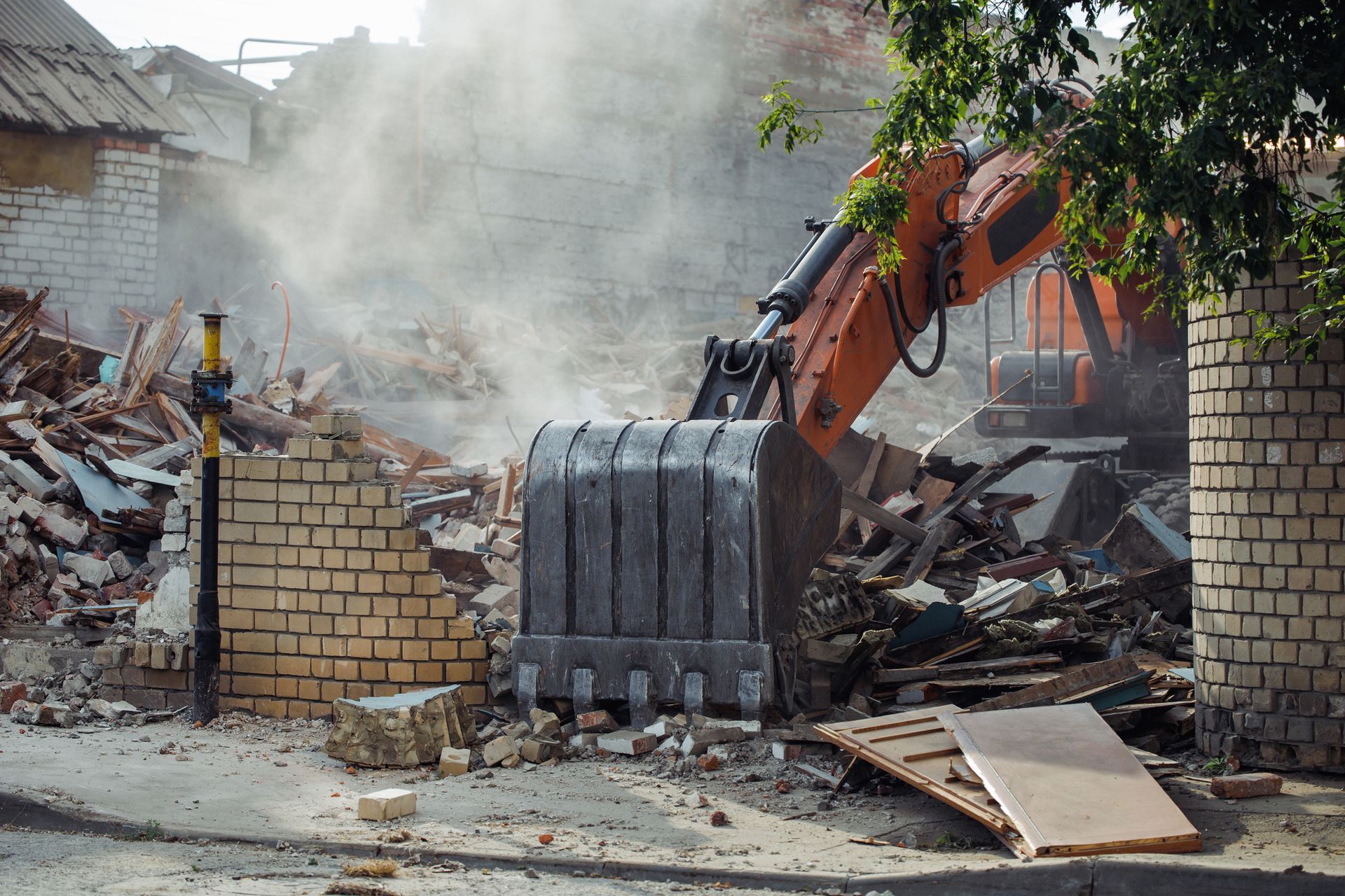 Construction machinery demolished brick building.