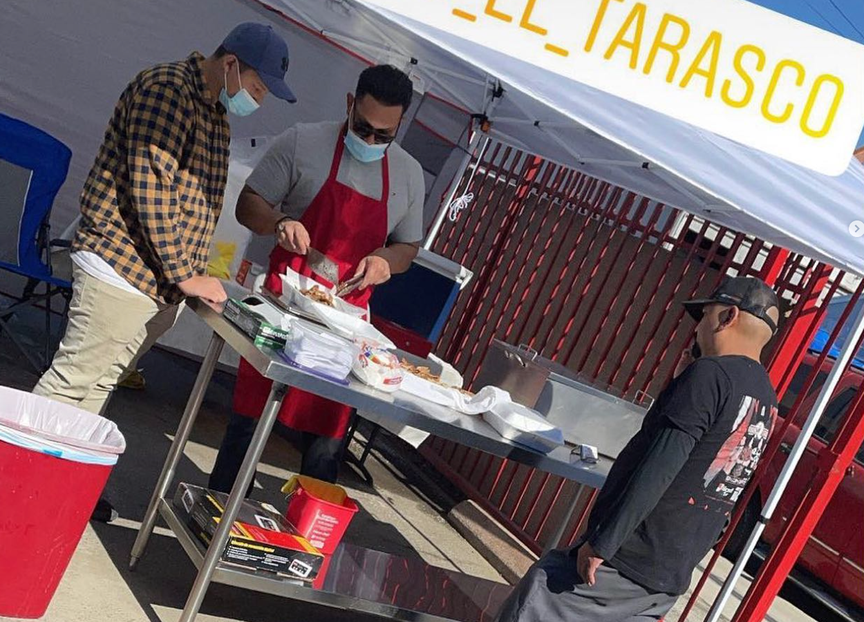 Image of our owner preparing carnitas