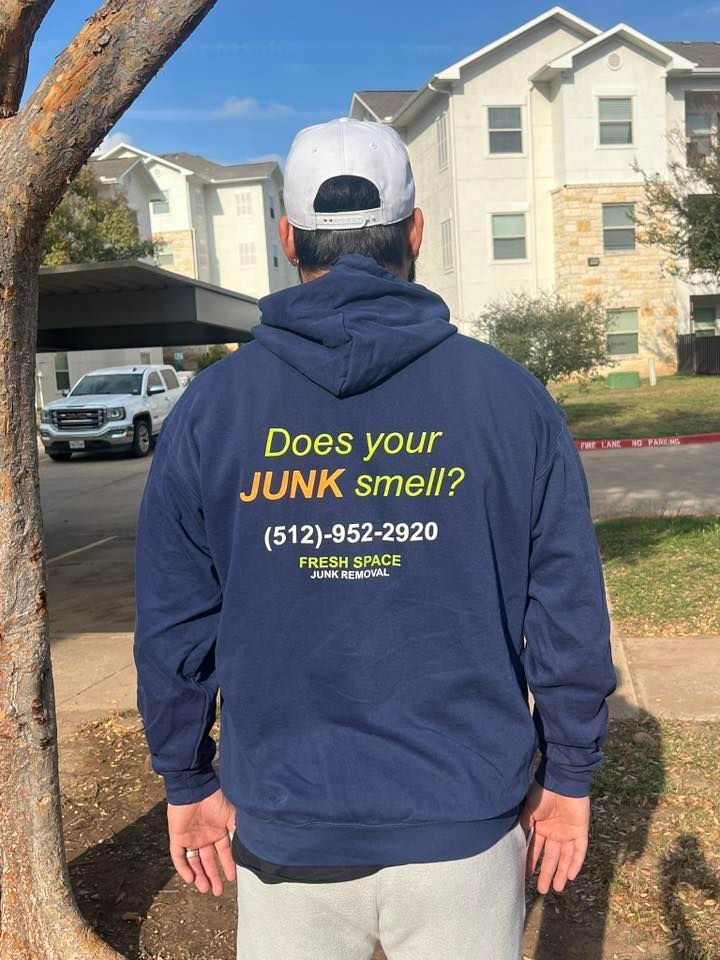 A person wearing a dark blue hoodie with 