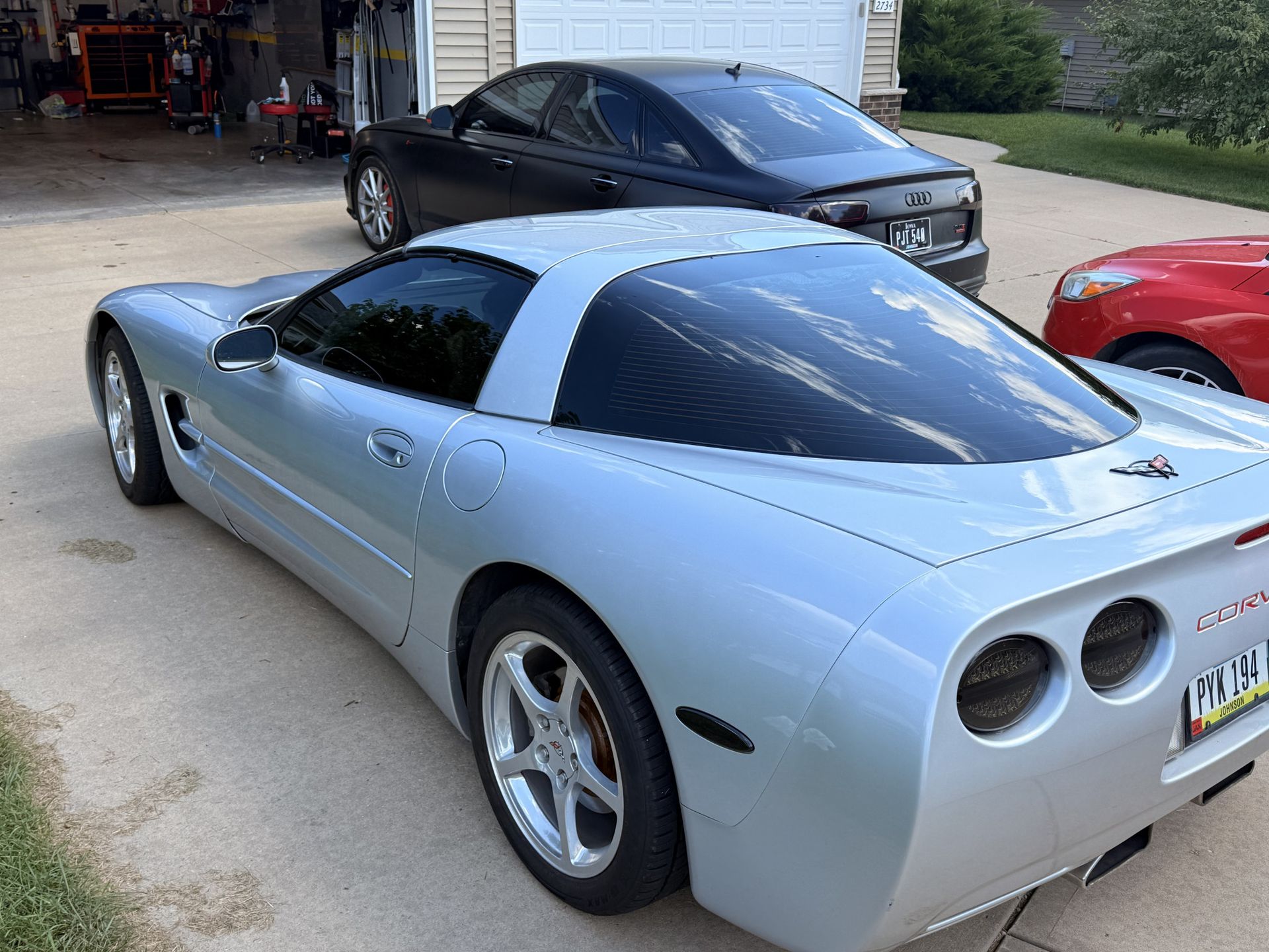 Silver Chevrolet Corvette with dark window tint by Next Tier Tinting