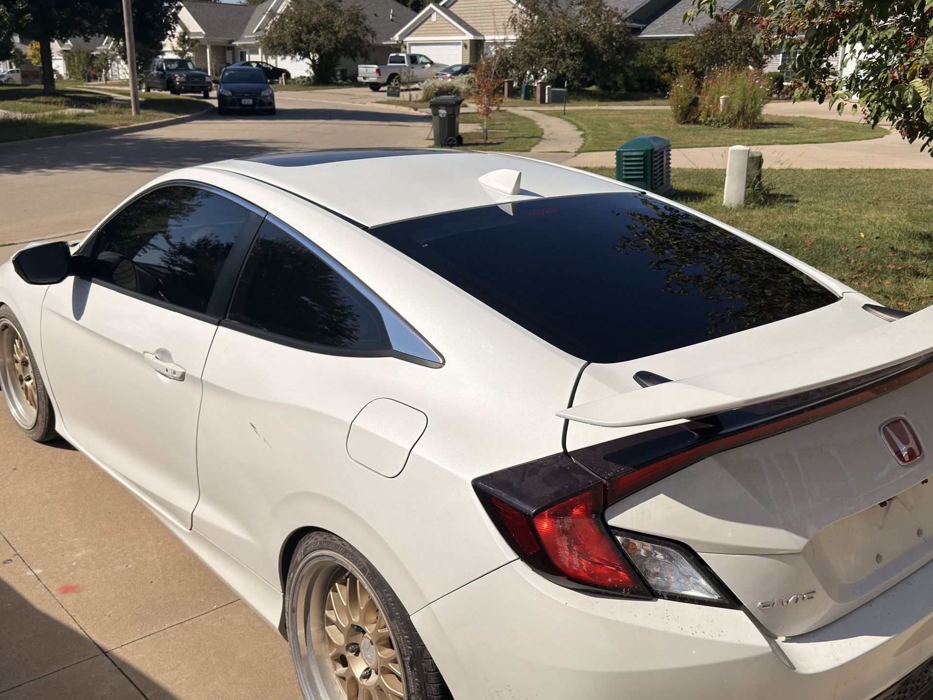 Silver luxury coupe with ceramic window tint inside Iowa City shop