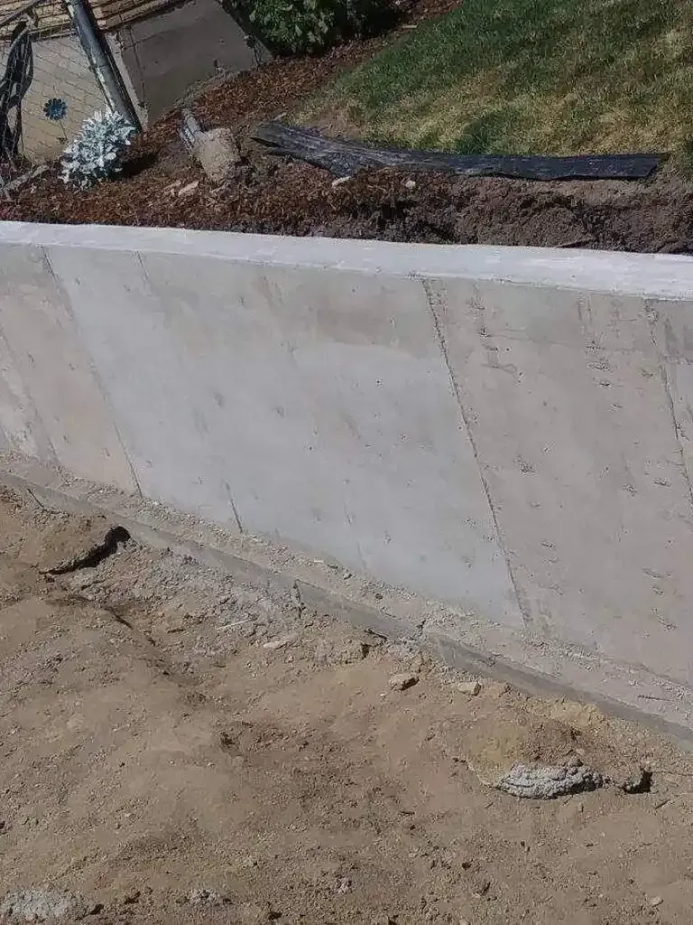 Expert grading and base preparation of concrete sidewalk installation