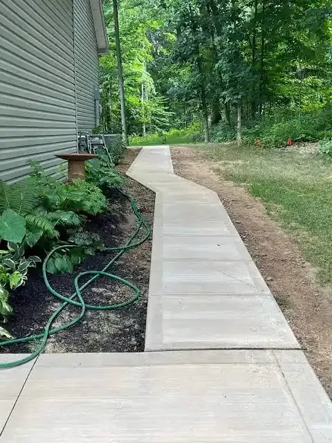 Expert grading and base preparation of concrete sidewalk installation