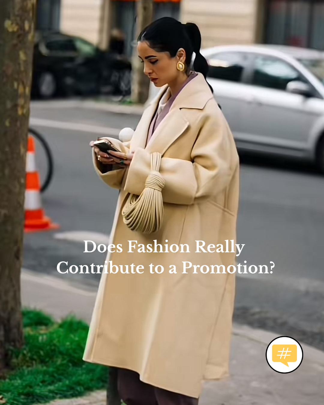 A woman in professional attire is reflecting on fashion, executive presence and promotion at work.