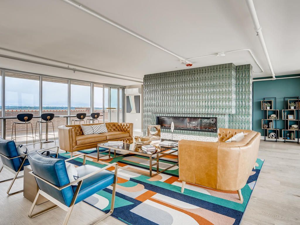 A living room filled with furniture and a fireplace