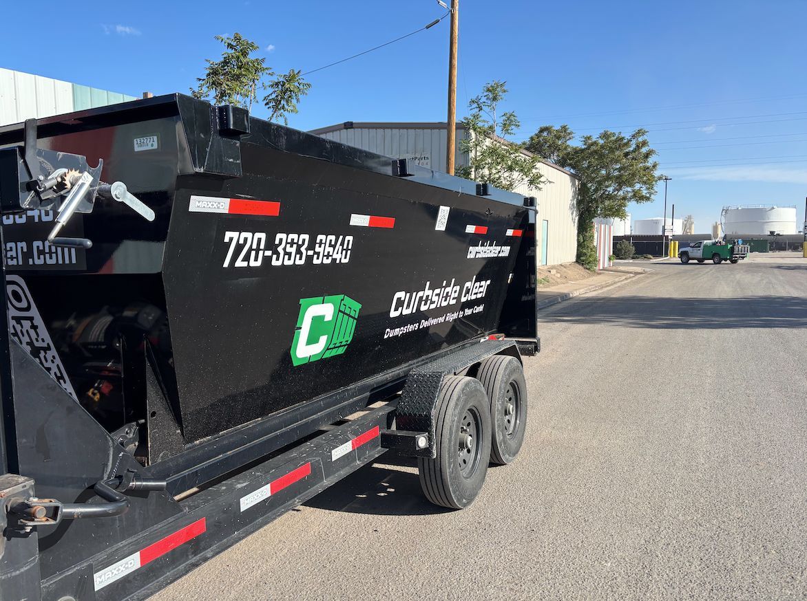 Black utility trailer with a green 