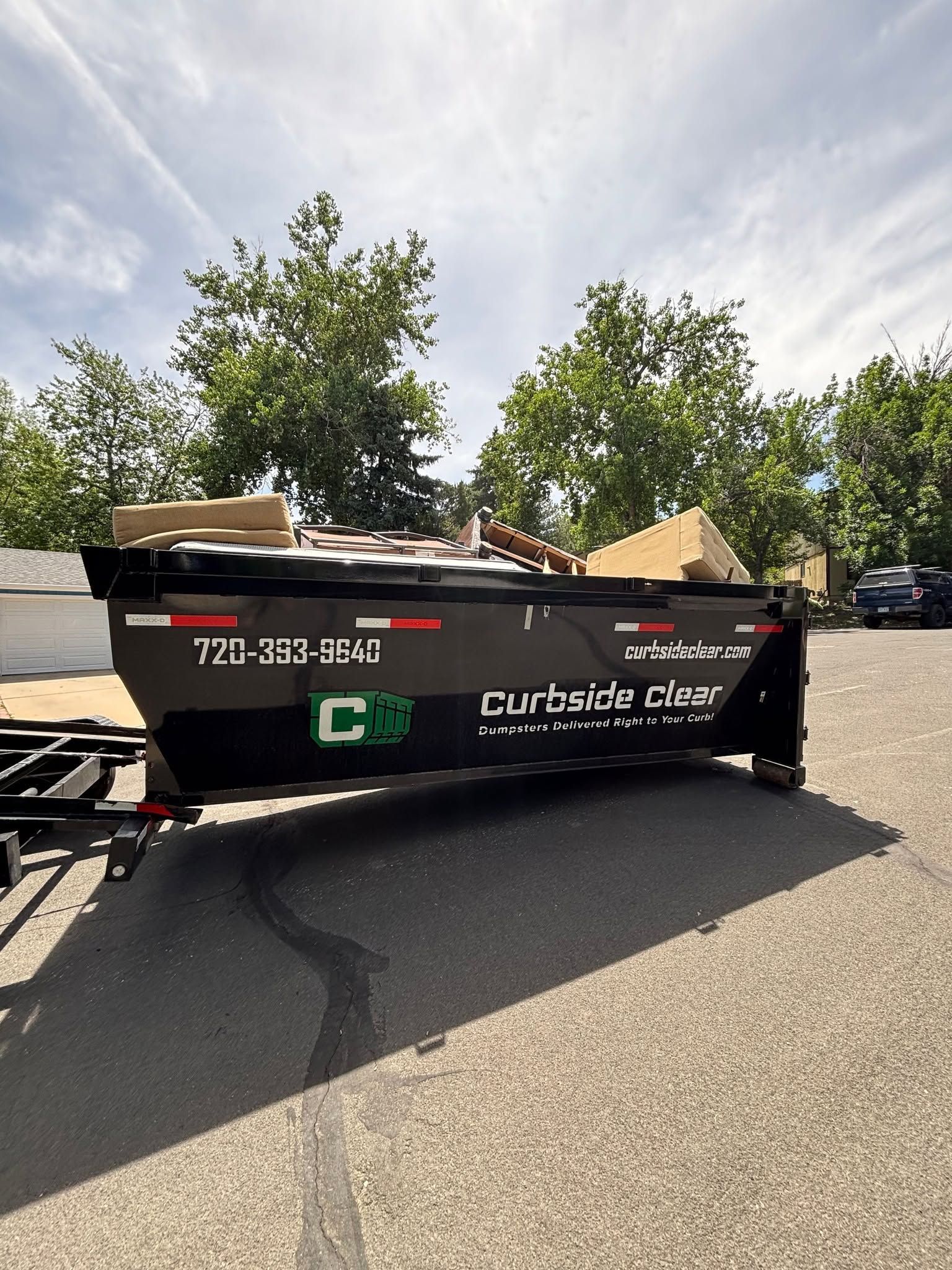 Remodel debris in a Curbside Clear dumpster for Lakewood CO renovation project