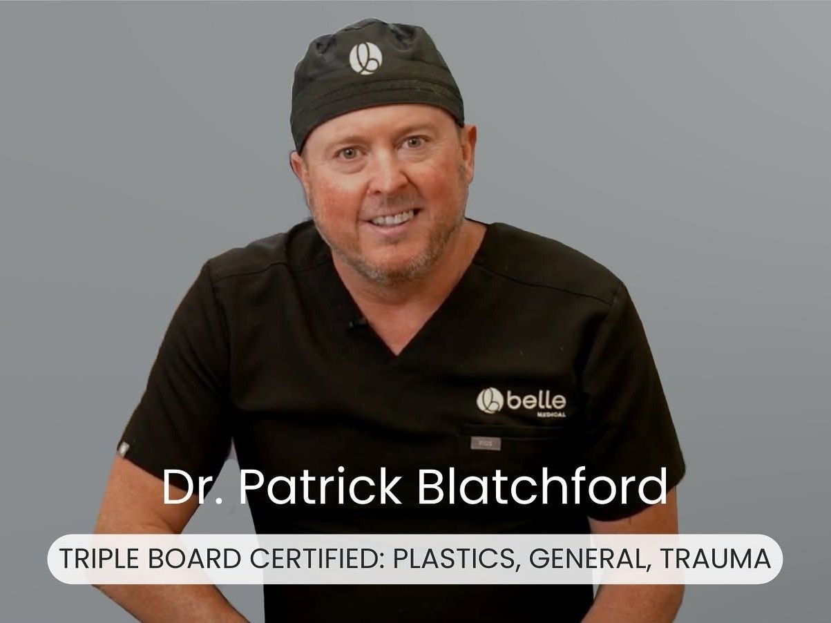 Portrait of Dr. Patrick Blatchford in black scrubs and cap, seated against a gray background, with credentials text.