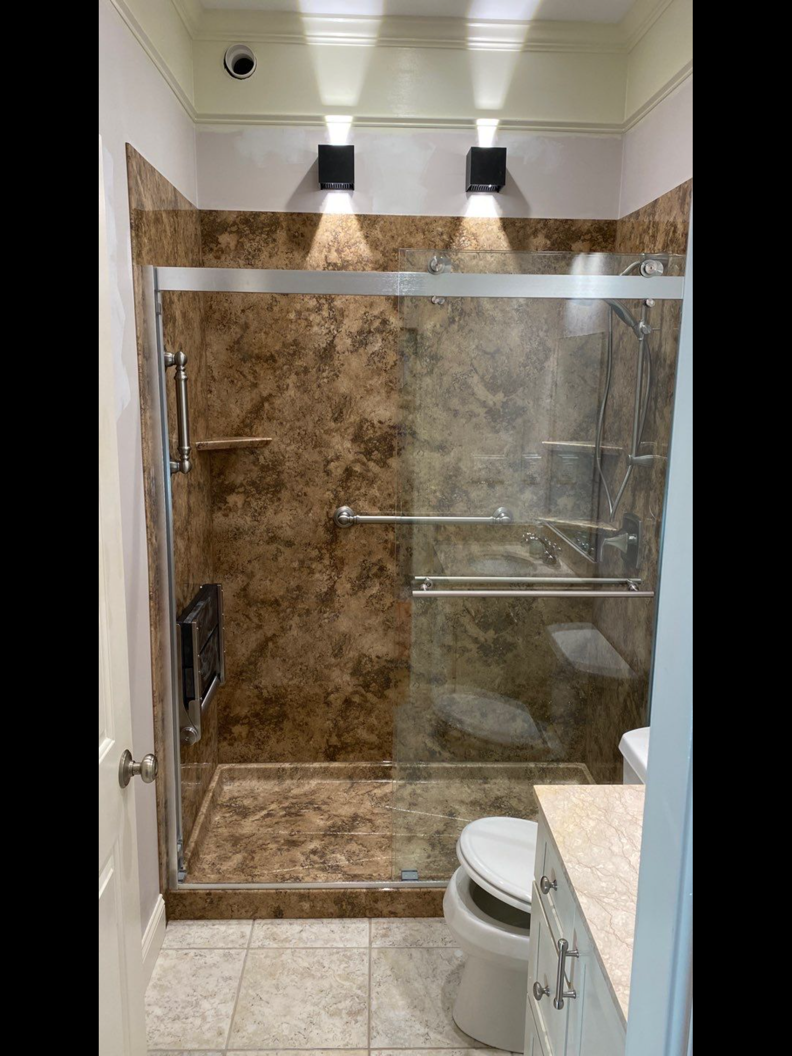 modern walk in master shower brown tile