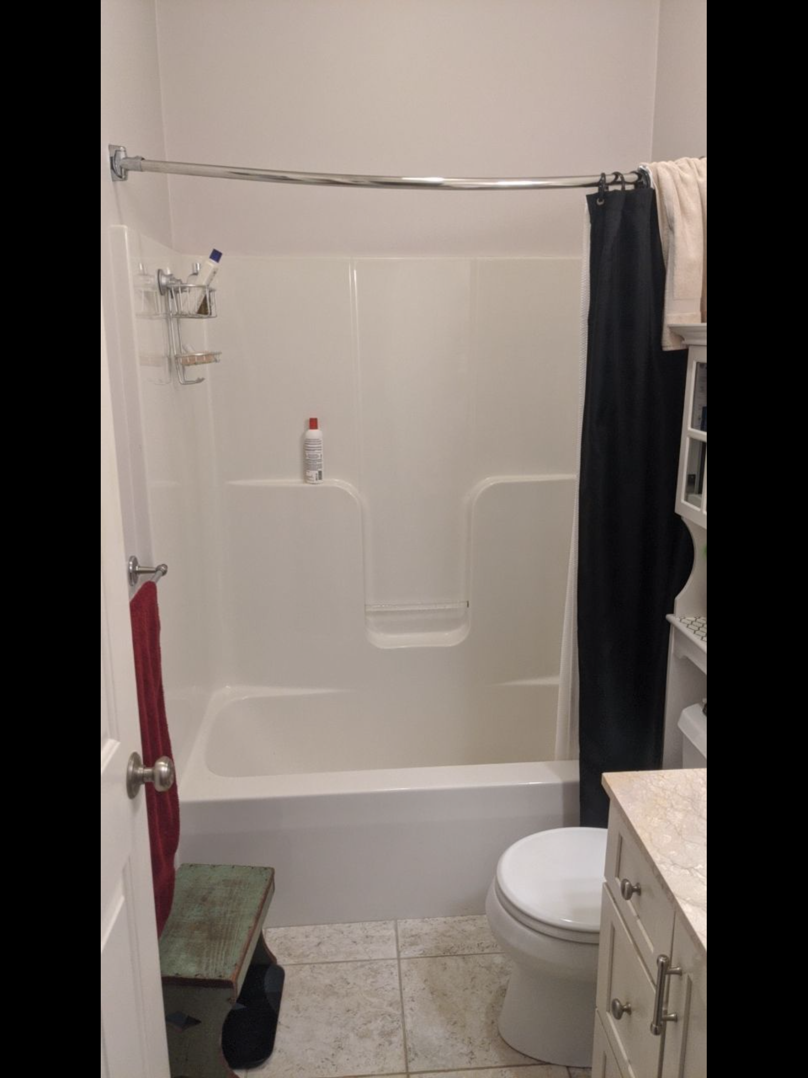 outdated white shower and tub