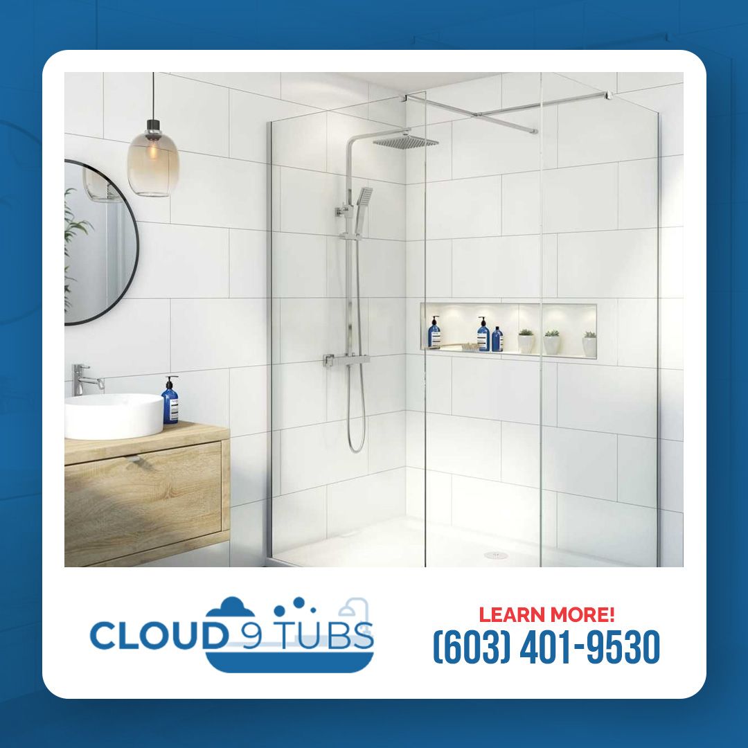 A modern bathroom with a glass walk-in shower and white tile walls, featuring Cloud 9 Tubs branding and a contact number.