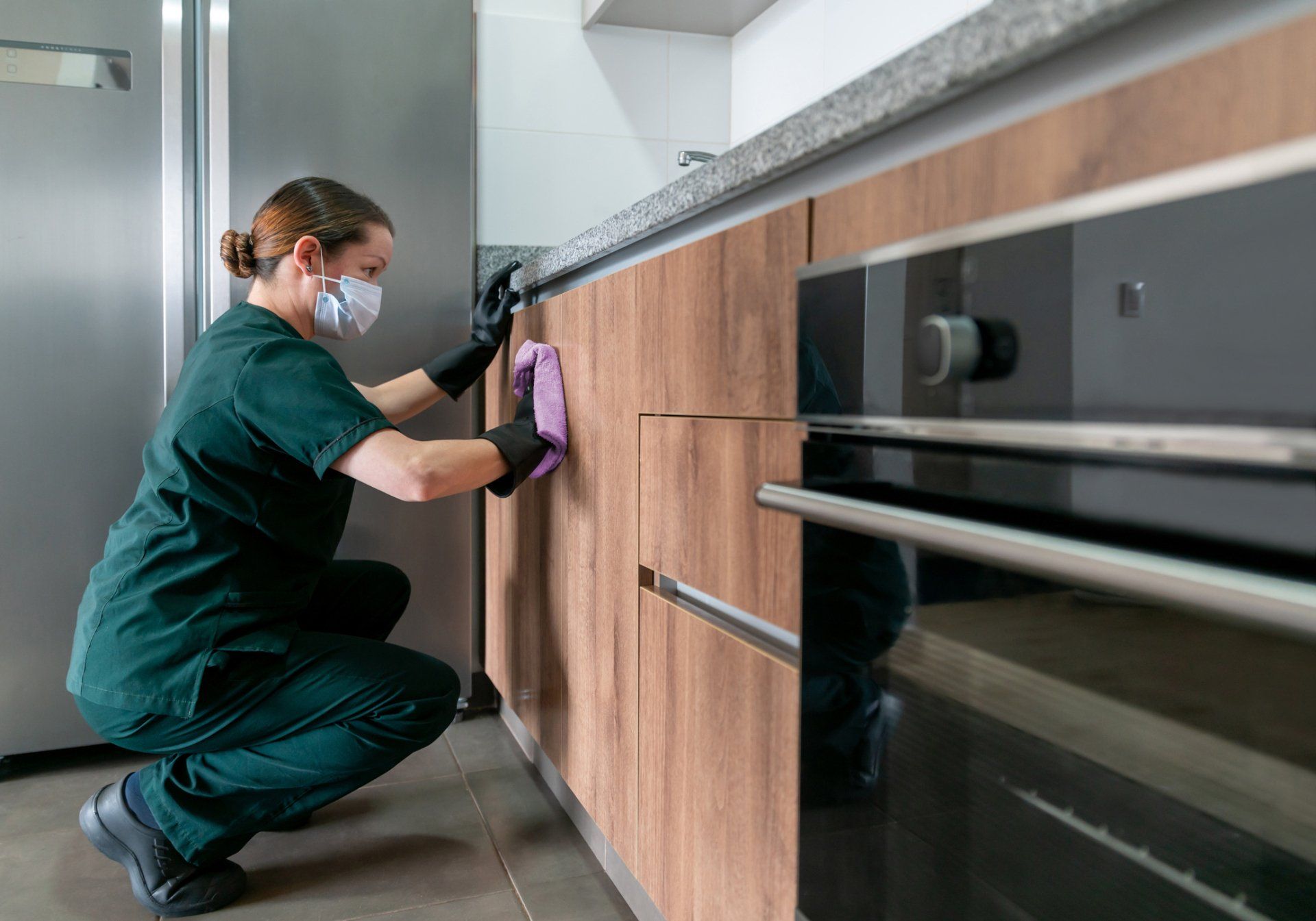 Woman Cleaning Cabinet — Medford, OR — Rogue Valley Maids