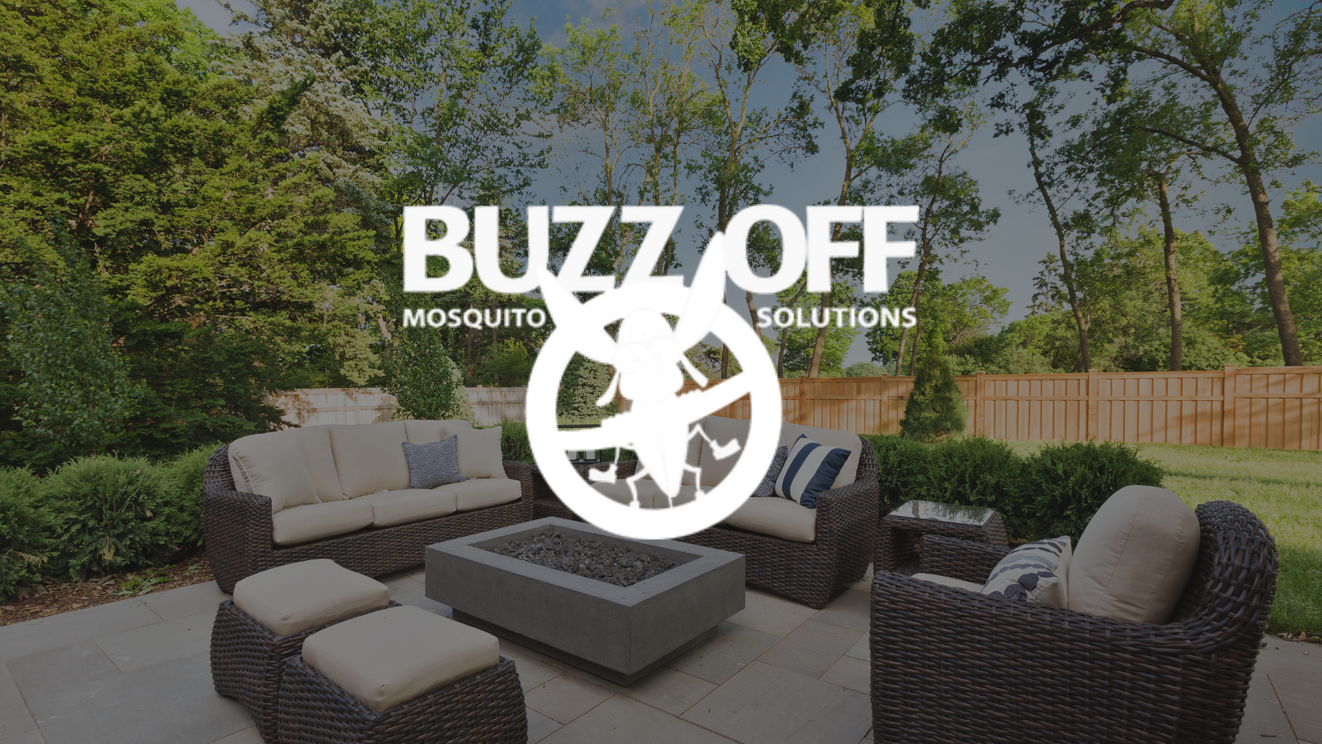 A patio with wicker furniture and a logo for buzz off mosquito solutions.